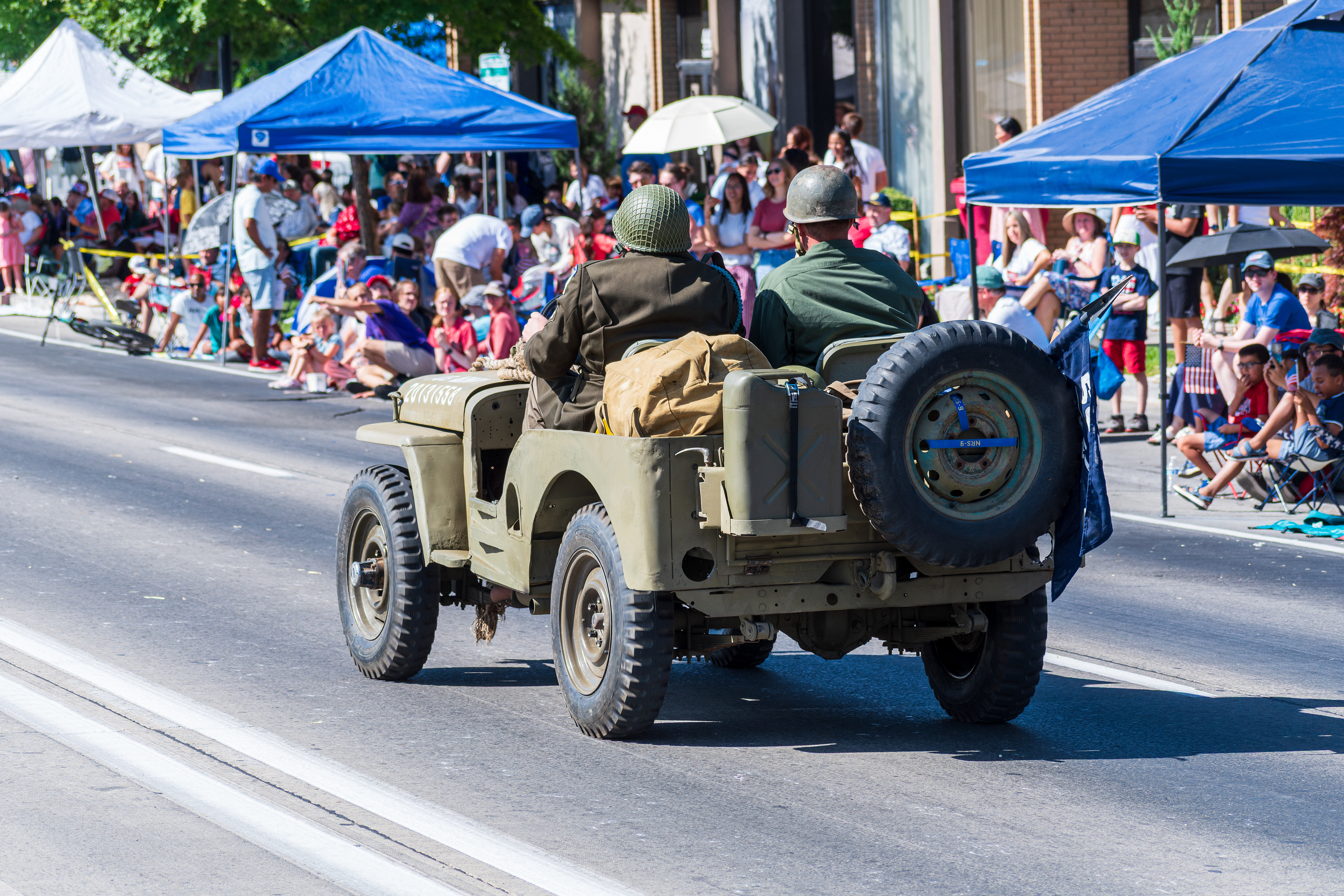 Provo, Utah – July 4, 2025: A reenactor in World War II-era uniform drives a restored jeep marked “1 509 PIB B CO” during the Grand Parade. The vehicle was part of a patriotic tribute to U.S. military