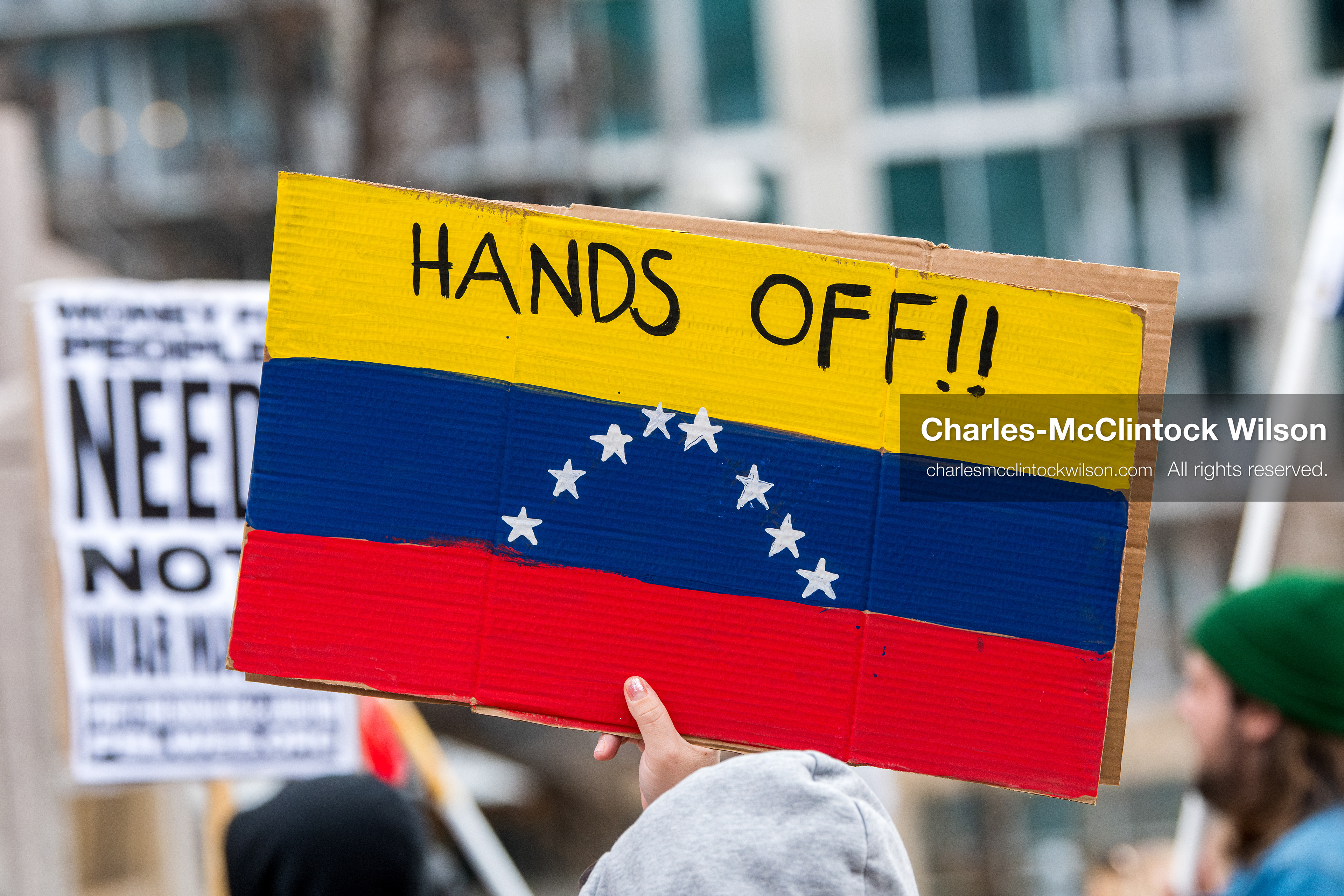 January 3, 2026, Salt Lake City, Utah, USA: A protester holds a sign during a demonstration against US action in Venezuela outside the Wallace Federal Building in Salt Lake City, Utah. The protest was part of a nationwide mobilization responding to recent military developments. (Credit Image: (c) Charles‑McClintock Wilson/ZUMA Press Wire)