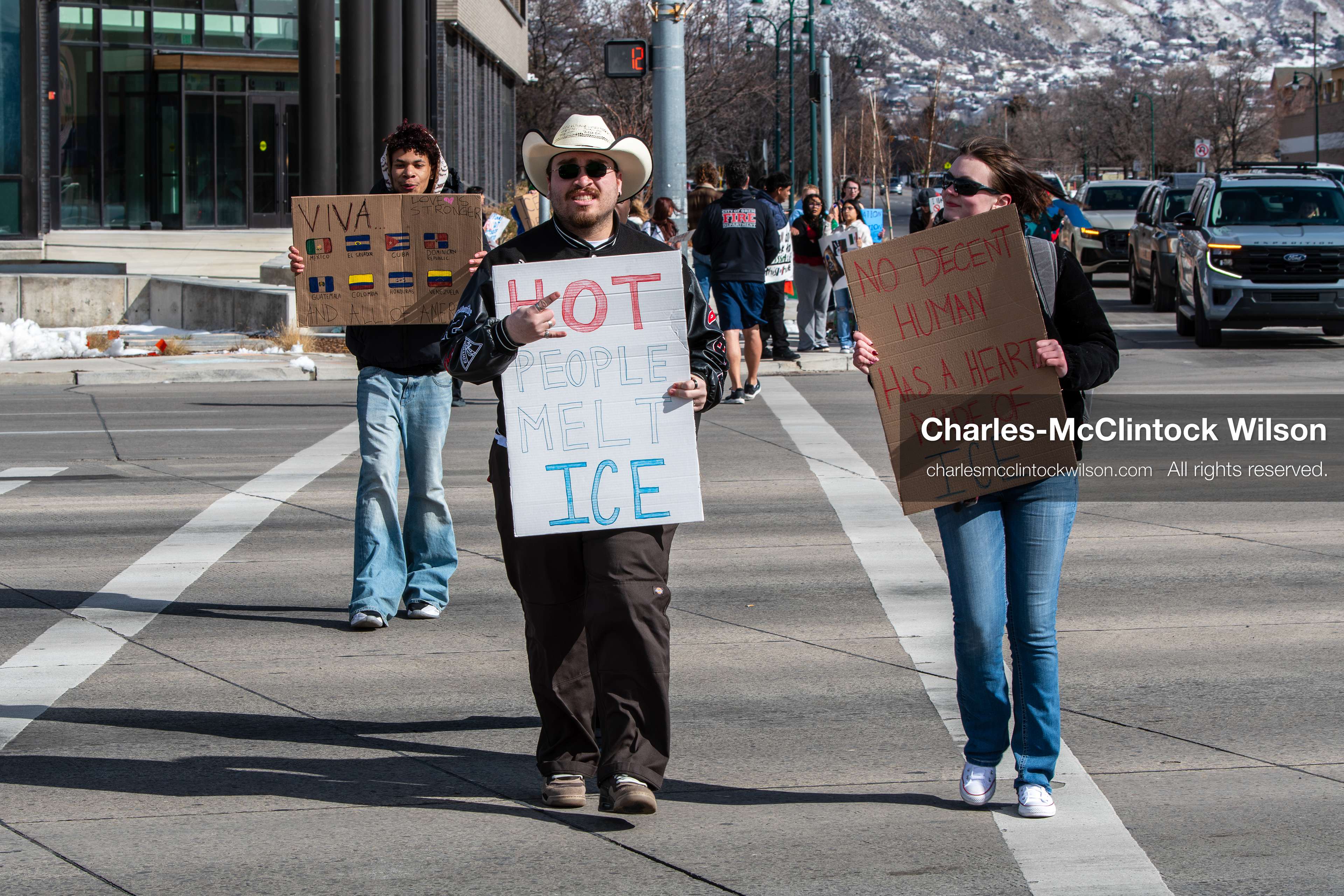 February 20, 2026, Orem, Utah, USA: Participants cross State Street in front of Orem City Hall during a student led protest against ICE. Demonstrators move through the crosswalk as vehicles wait in the area. (Credit Image: © Charles McClintock Wilson/ZUMA Press Wire)
