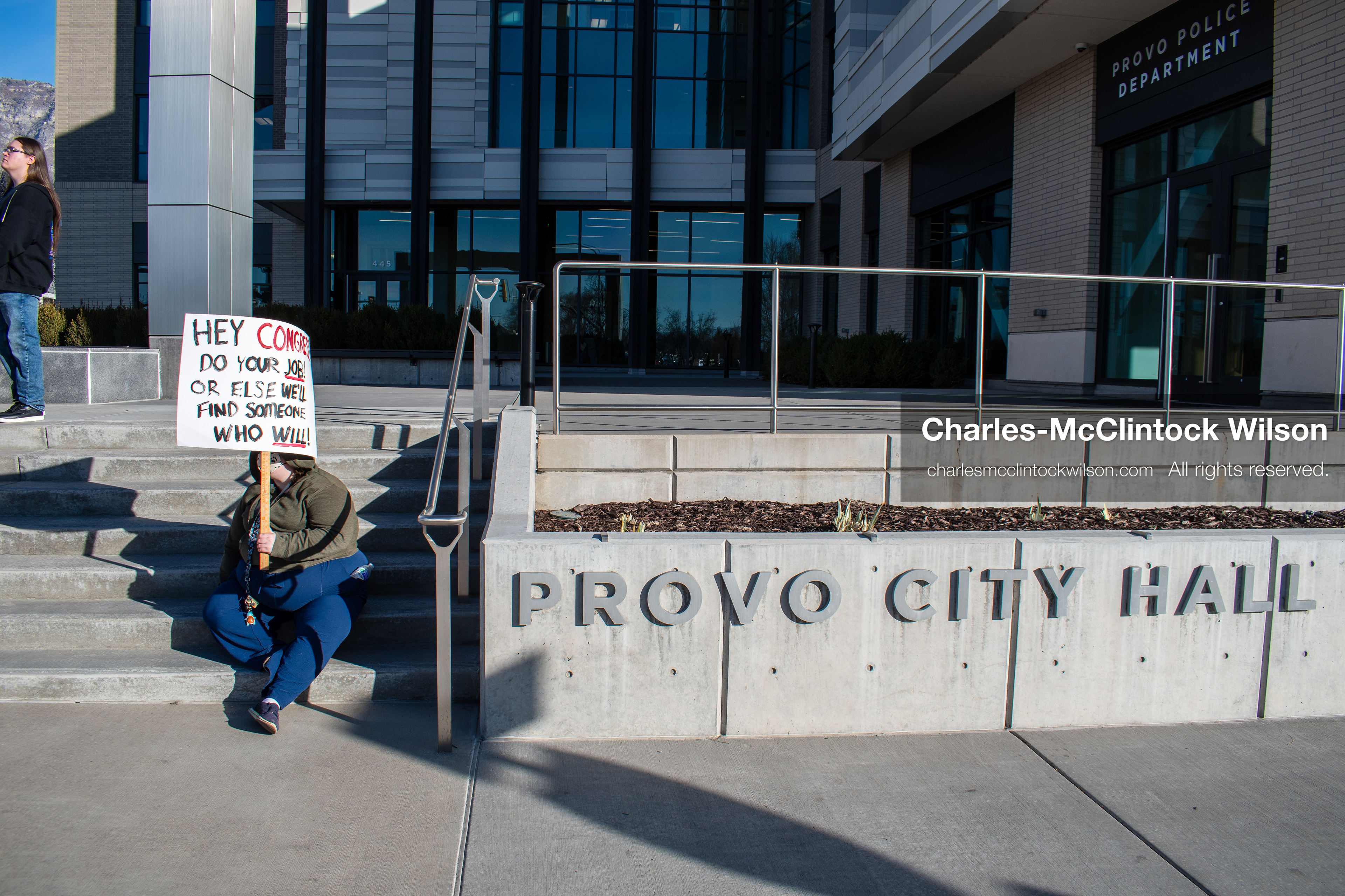  January 20, 2026, Provo, Utah, USA: A demonstrator stands outside Provo City Hall during the Free America Walkout protest in Provo Utah on January 20 2026. The nationwide event called for immigration reform and changes to detention practices. 