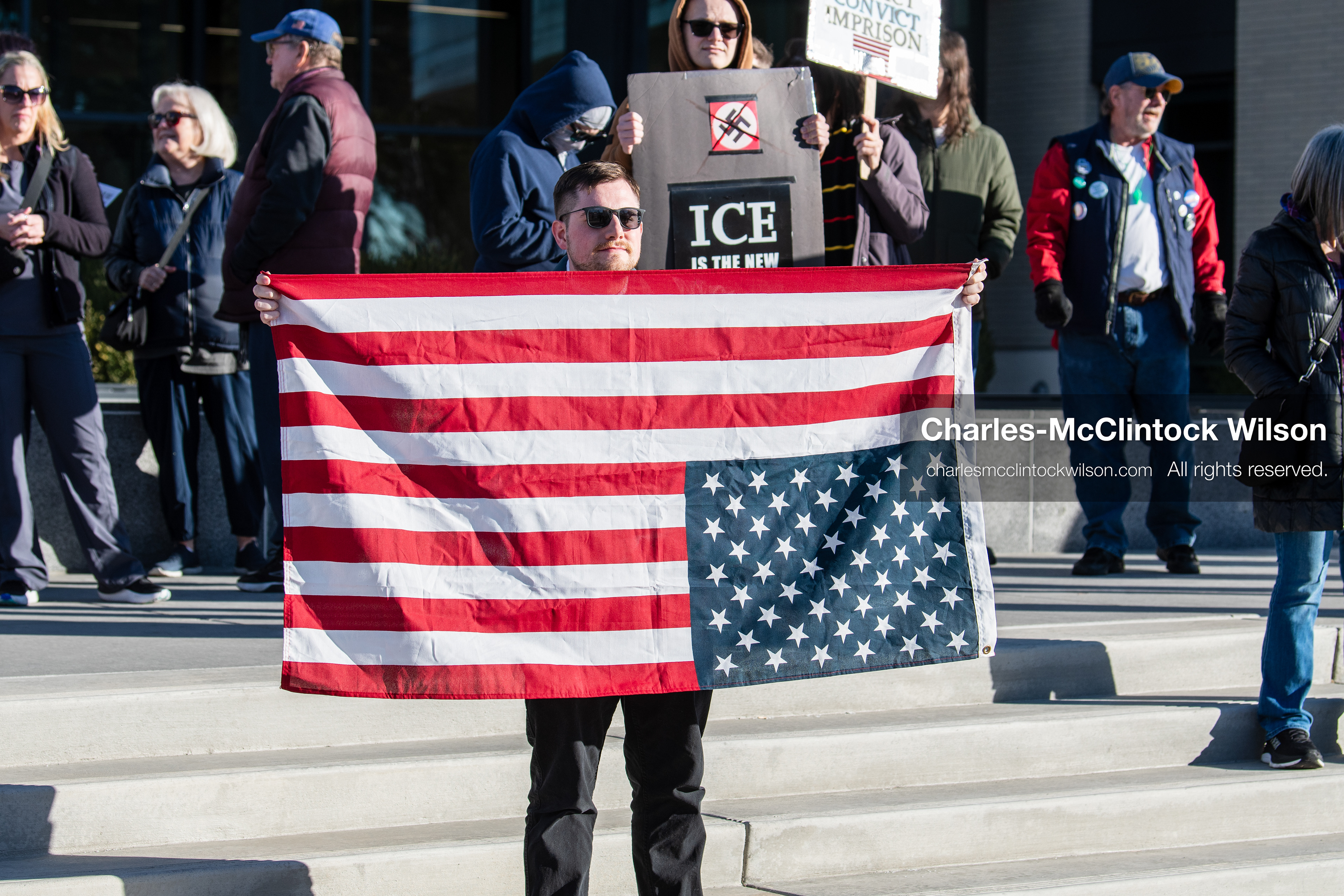January 20, 2026, Provo, Utah, USA: A protester displays an upside down American flag and a sign opposing ICE during the Free America Walkout outside Provo City Hall in Provo Utah on January 20 2026. The nationwide protest called for justice immigration reform and an end to detention practices. (Credit Image: © Charles-McClintock Wilson/ZUMA Press Wire)