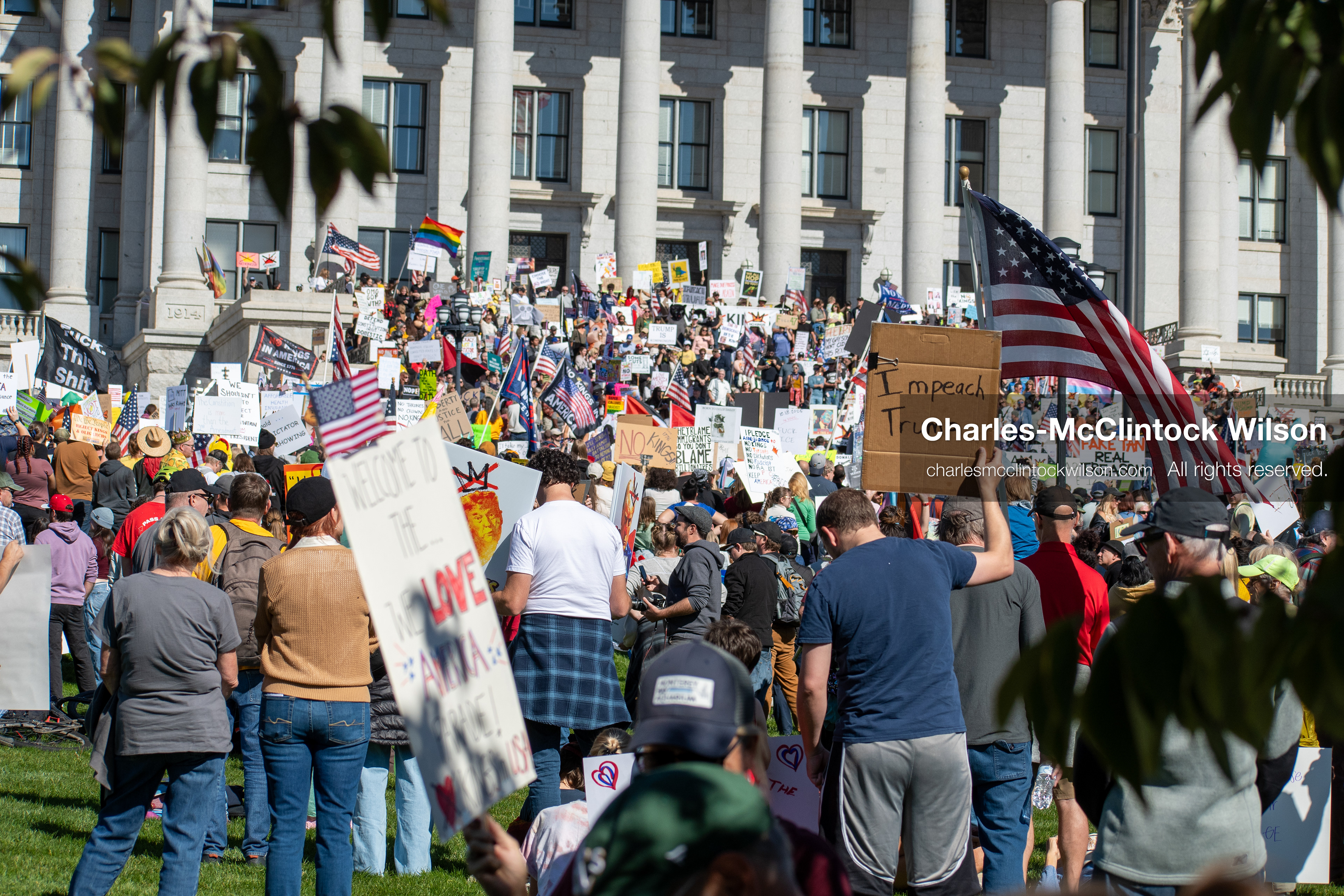 October 18, 2025, Salt Lake City, Utah, USA: Demonstrators participate in a "No Kings" protest held at the Utah State Capitol. Participants hold signs and flags during the public gathering.