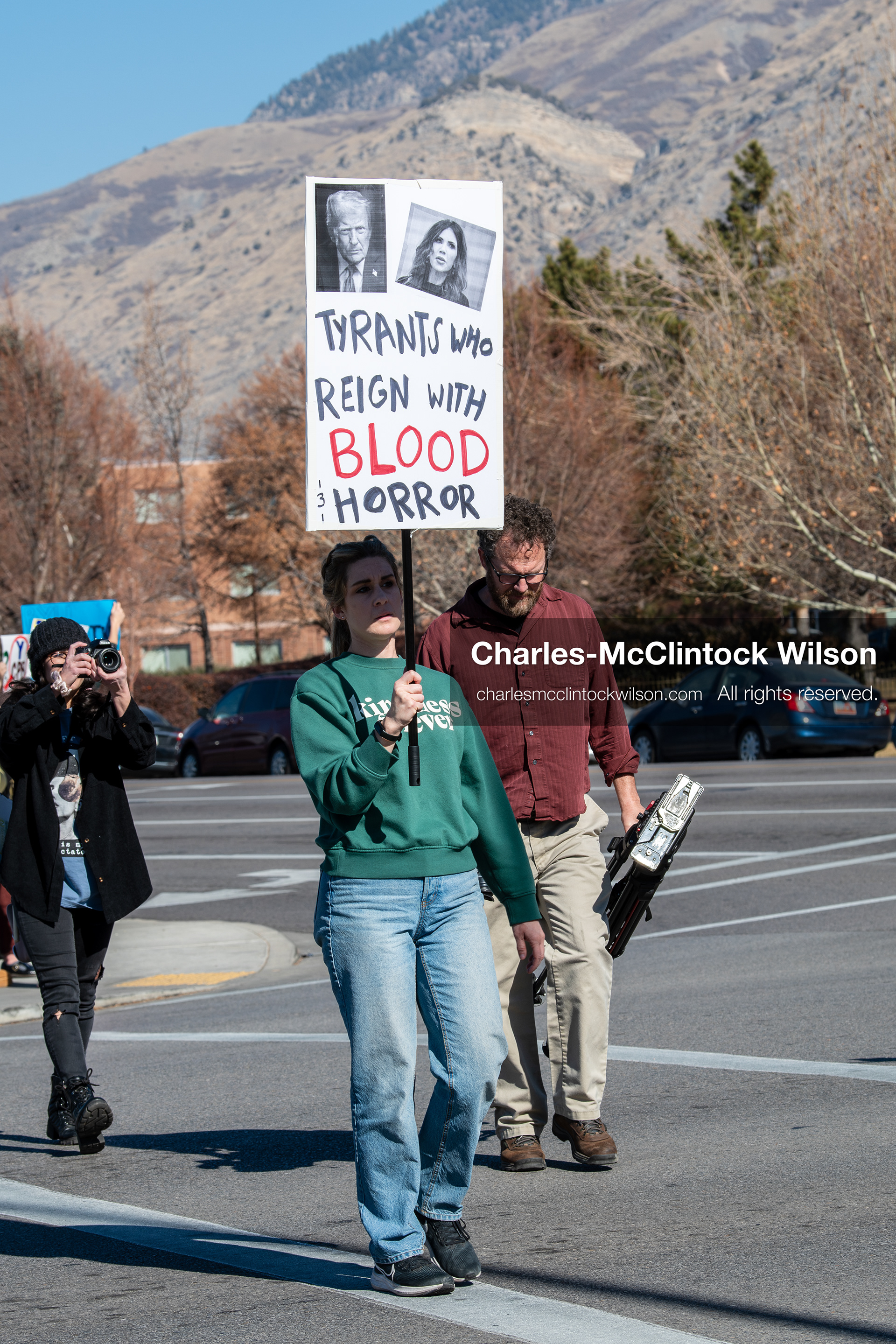 February 5, 2026, Provo, Utah, USA: A demonstrator holds a sign during a gathering near Brigham Young University in Provo where students and community members protested the presence of US Customs and Border Protection recruiters at a career fair held on the BYU campus. (Credit Image: © Charles McClintock Wilson/ZUMA Press Wire)