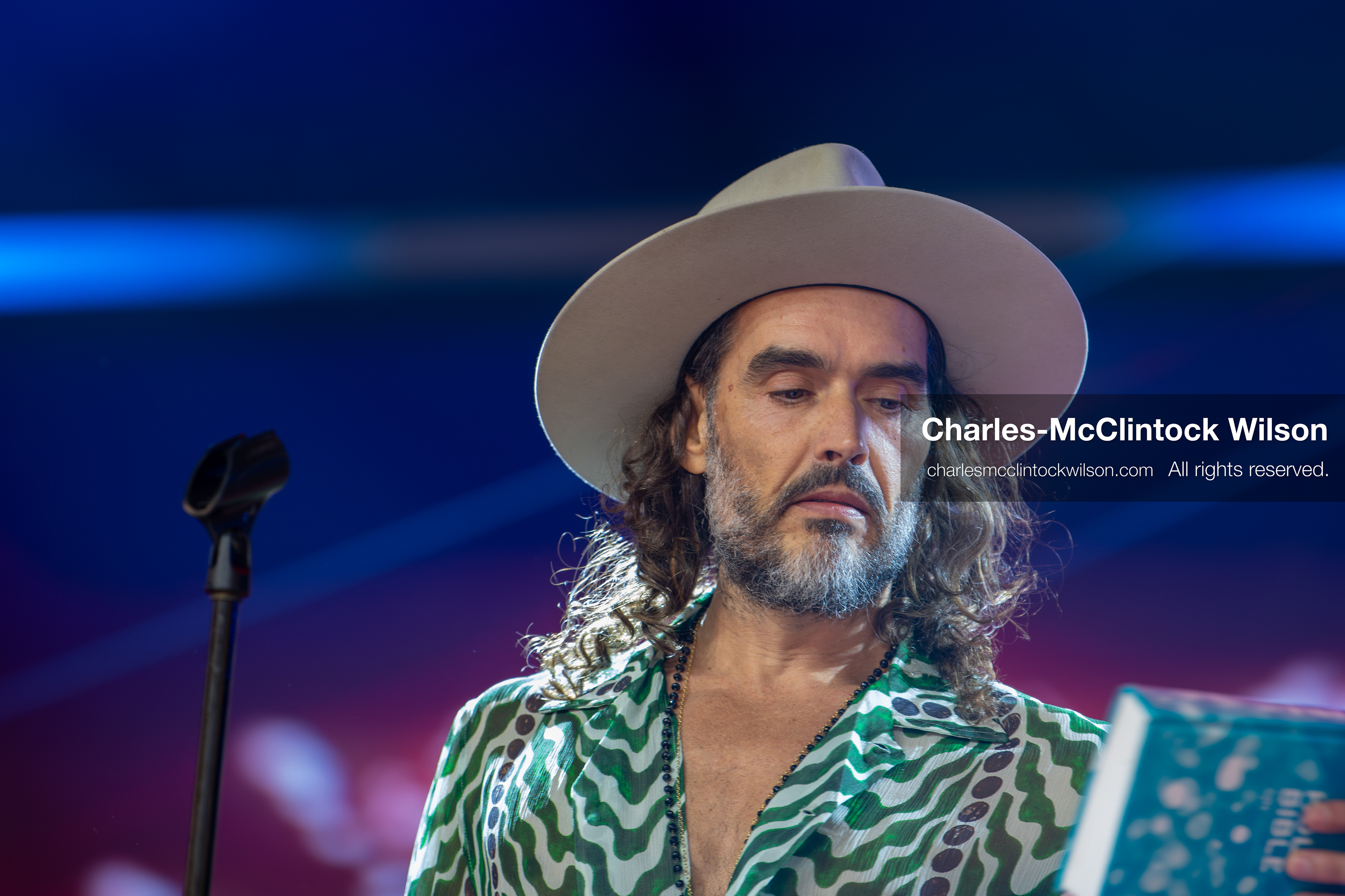 December 18, 2025, Phoenix, Arizona, USA: Russell Brand speaks during Day One of Turning Point USA’s AmericaFest 2025 at the Phoenix Convention Center in Phoenix, Arizona.   (Credit Image: © Charles‑McClintock Wilson/ZUMA Press Wire)