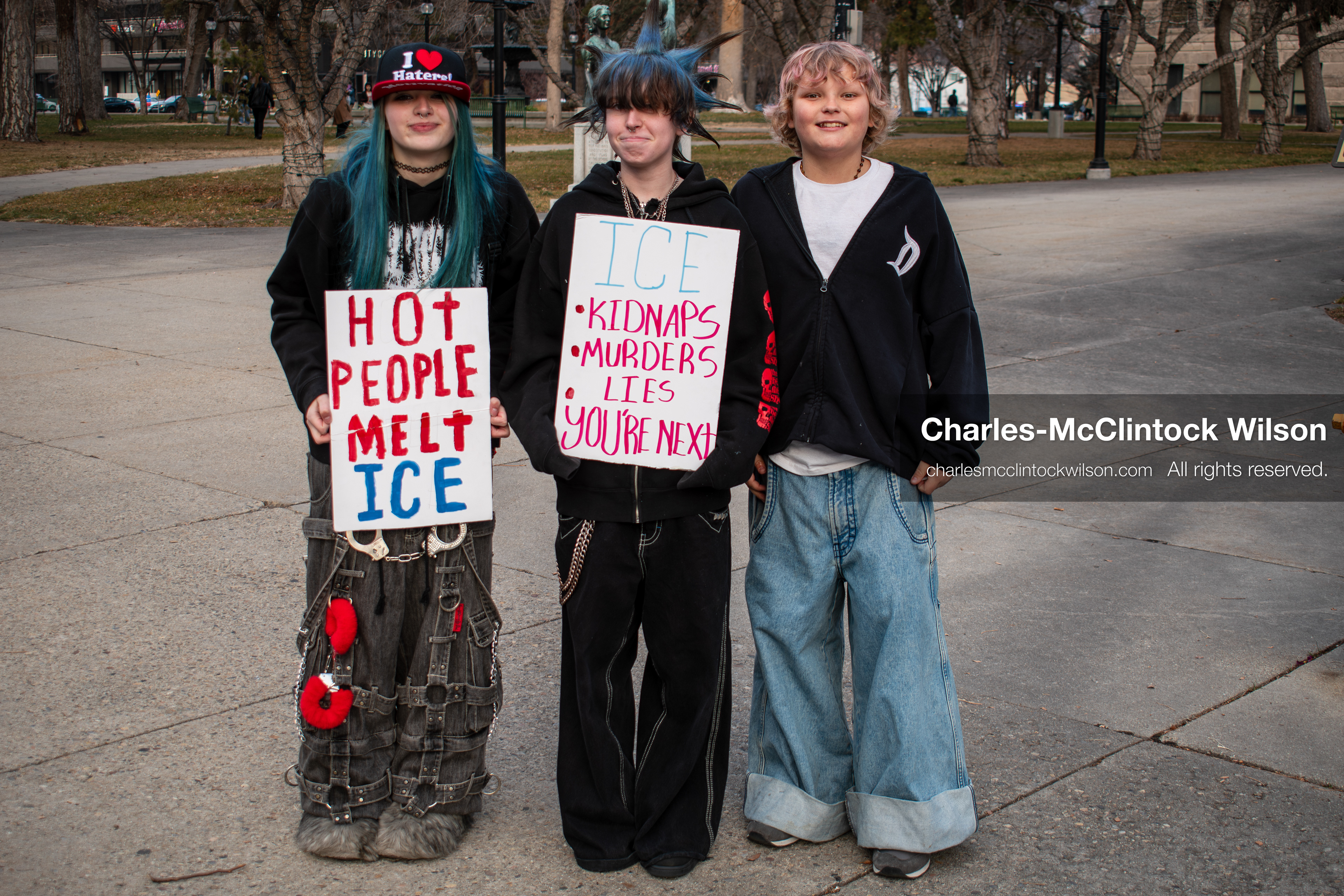 January 30, 2026, Salt Lake City, Utah, USA: Three young demonstrators stand on a paved plaza during an anti‑ICE protest in Salt Lake City, part of a nationwide response to immigration enforcement policies. (Credit Image: © Charles‑McClintock Wilson/ZUMA Press Wire)