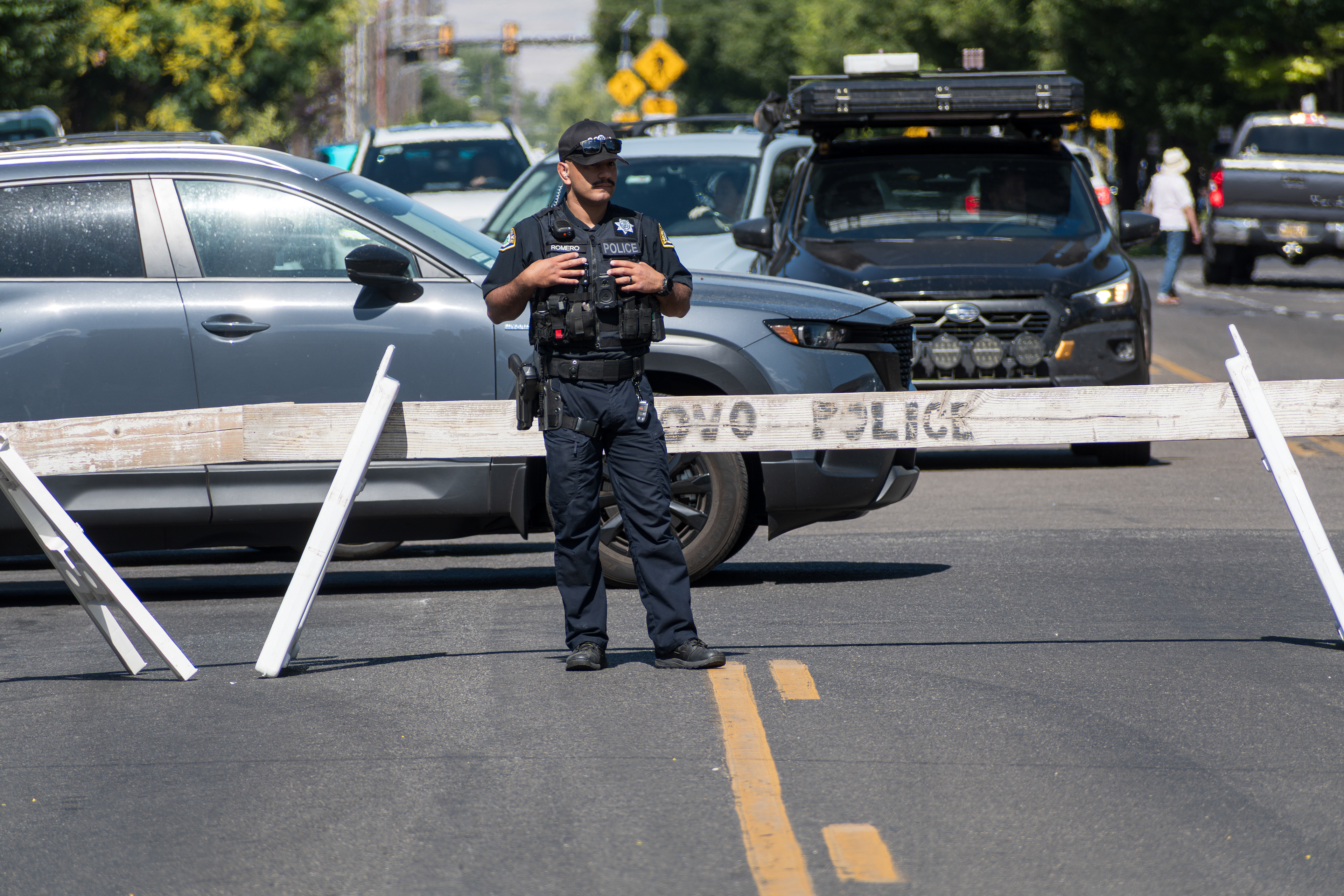 Provo, Utah – July 4, 2025: A Provo police officer stands in the middle of the road directing traffic during the Freedom Festival Grand Parade in downtown Provo.