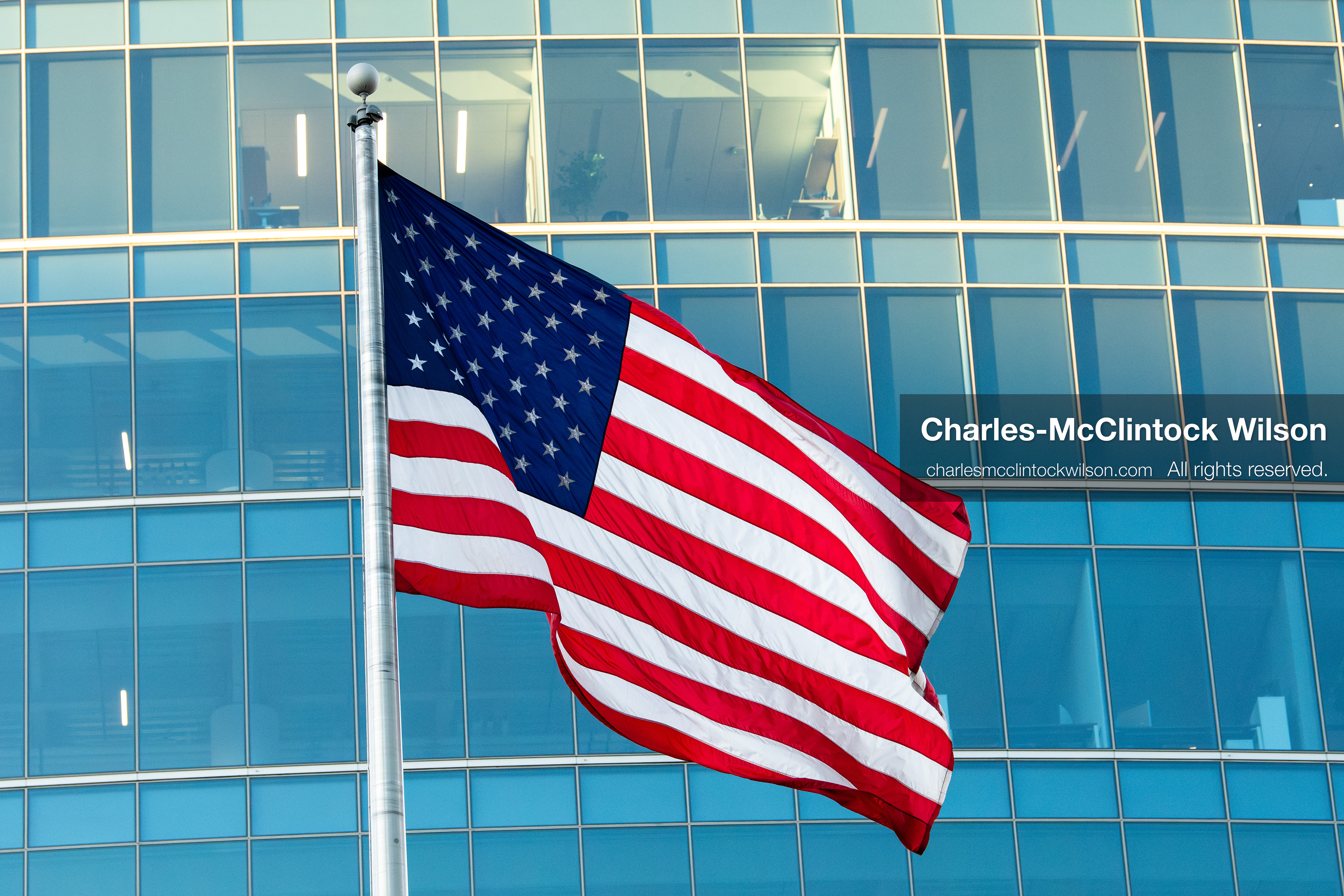 January 5, 2026, Salt Lake City, Utah, USA: The US flag flies outside the Wallace Federal Building during a protest on January 5, 2026. The rally, organized by Salt Lake Indivisible, called for congressional limits on presidential war powers following recent US military actions in Venezuela involving the government of Nicolas Maduro. Attendees signed petitions addressed to Utah US senators Mike Lee and John Curtis. (Credit Image: (c) Charles‑McClintock Wilson/ZUMA Press Wire)