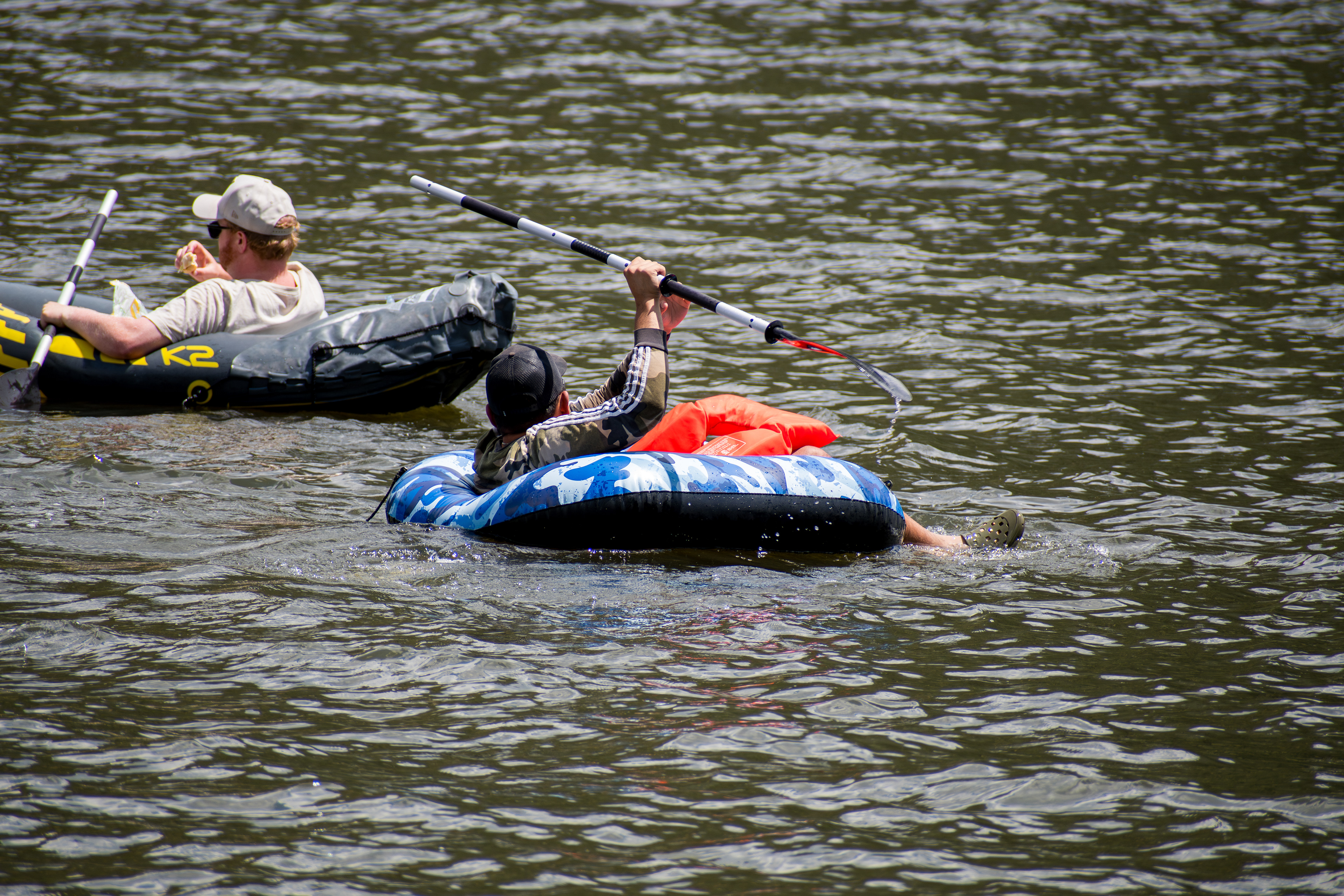 Summit County, Utah – July 20, 2025: People enjoy air rafting in an inflatable raft on the calm waters of Smith and Morehouse Reservoir.