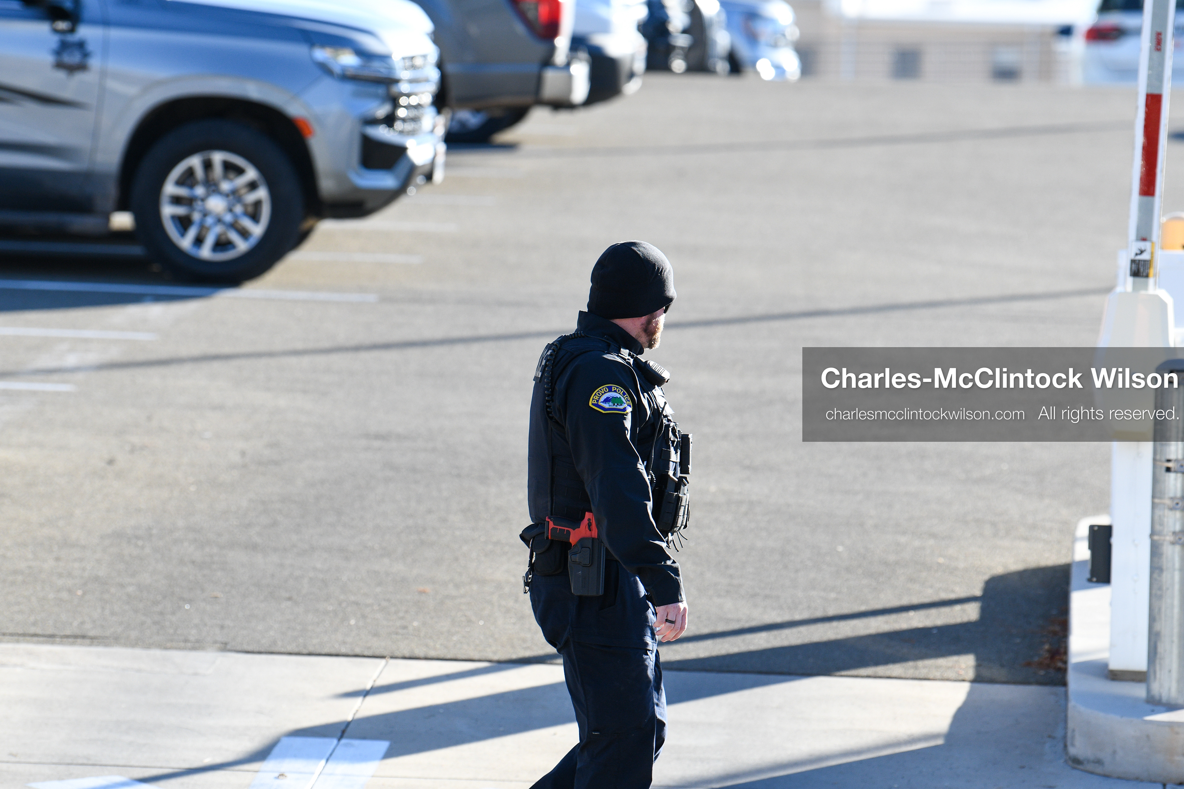 PROVO, UTAH, USA – DECEMBER 11, 2025: A Provo Police officer patrols on foot near the Fourth District Court in Provo during the first in‑person court appearance of Tyler Robinson in the Charlie Kirk murder case. (Credit Image: © Charles‑McClintock Wilson/ZUMA Press Wire)