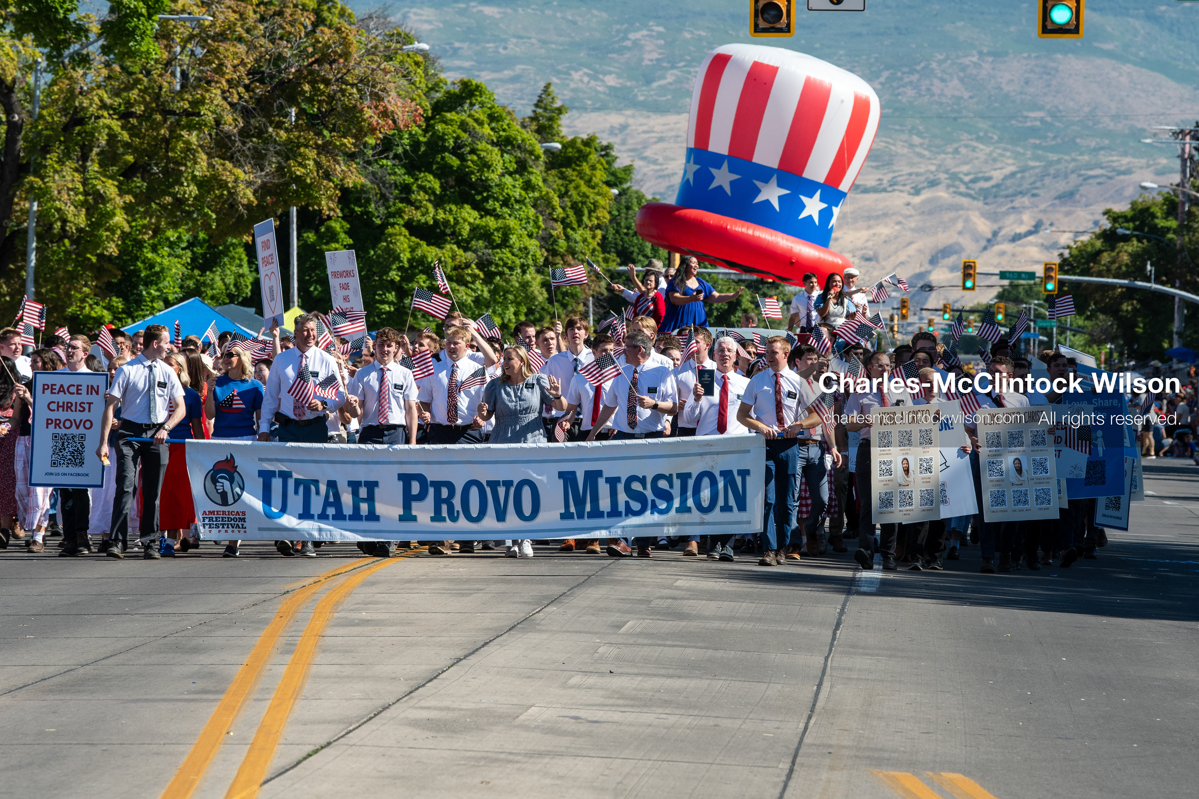 July 4, 2026, Provo, Utah, USA: Missionaries from The Church of Jesus Christ of Latter-day Saints wear black name badges and wave American flags while marching down the street during America's Freedom Festival Grand Parade in Provo, Utah, Saturday, July 4, 2026. The annual Independence Day event features expanded programming to honor the 250th anniversary of United States independence. (Credit Image: © Charles-McClintock Wilson/ZUMA Press Wire)