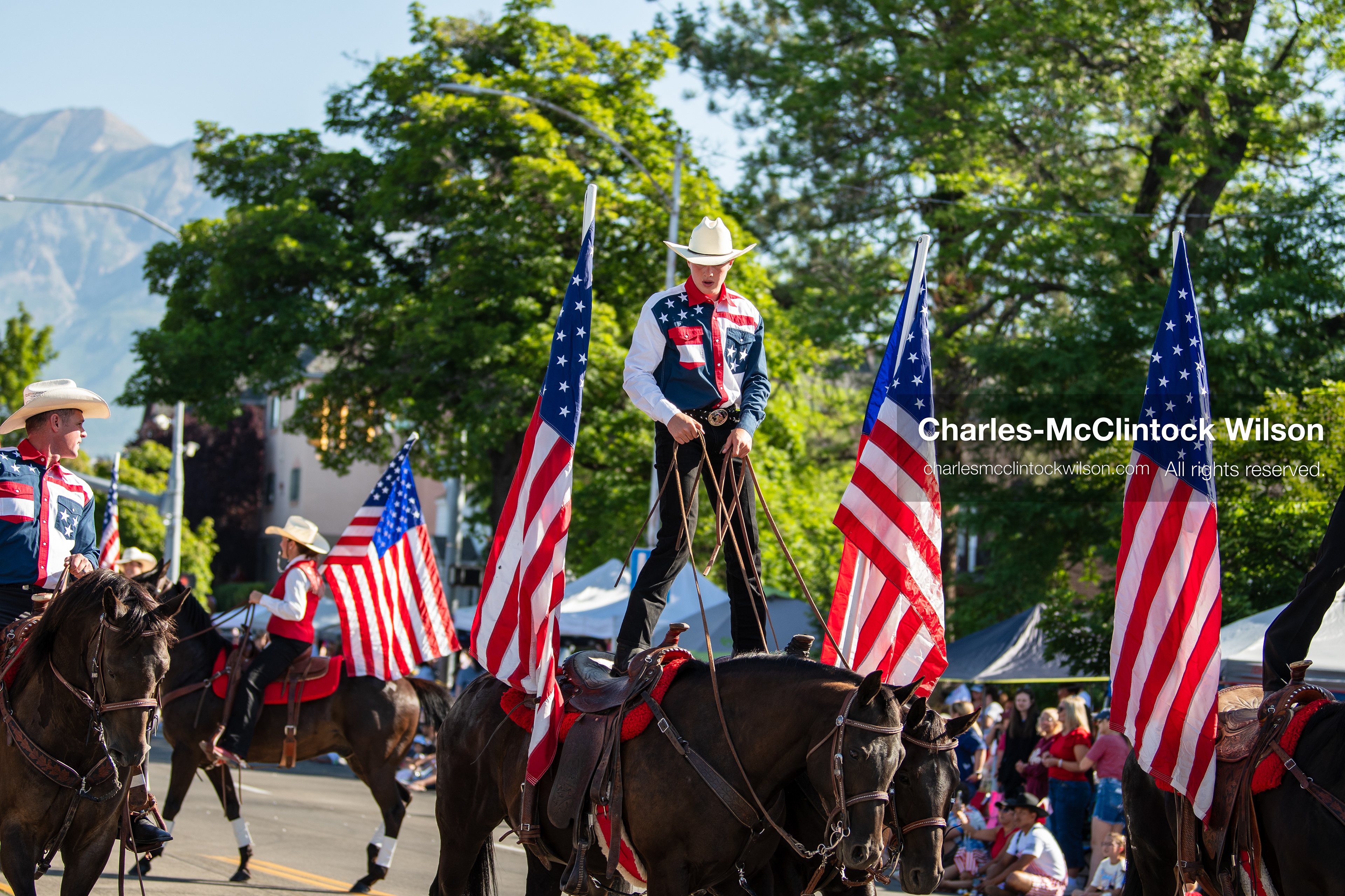  July 4, 2026, Provo, Utah, USA: Equestrian performers balance upright on horseback while carrying American flags down the street during America's Freedom Festival Grand Parade in Provo, Utah, Saturday, July 4, 2026. The annual Independence Day event features expanded programming to honor the 250th anniversary of United States independence. (Credit Image: © Charles-McClintock Wilson/ZUMA Press Wire)