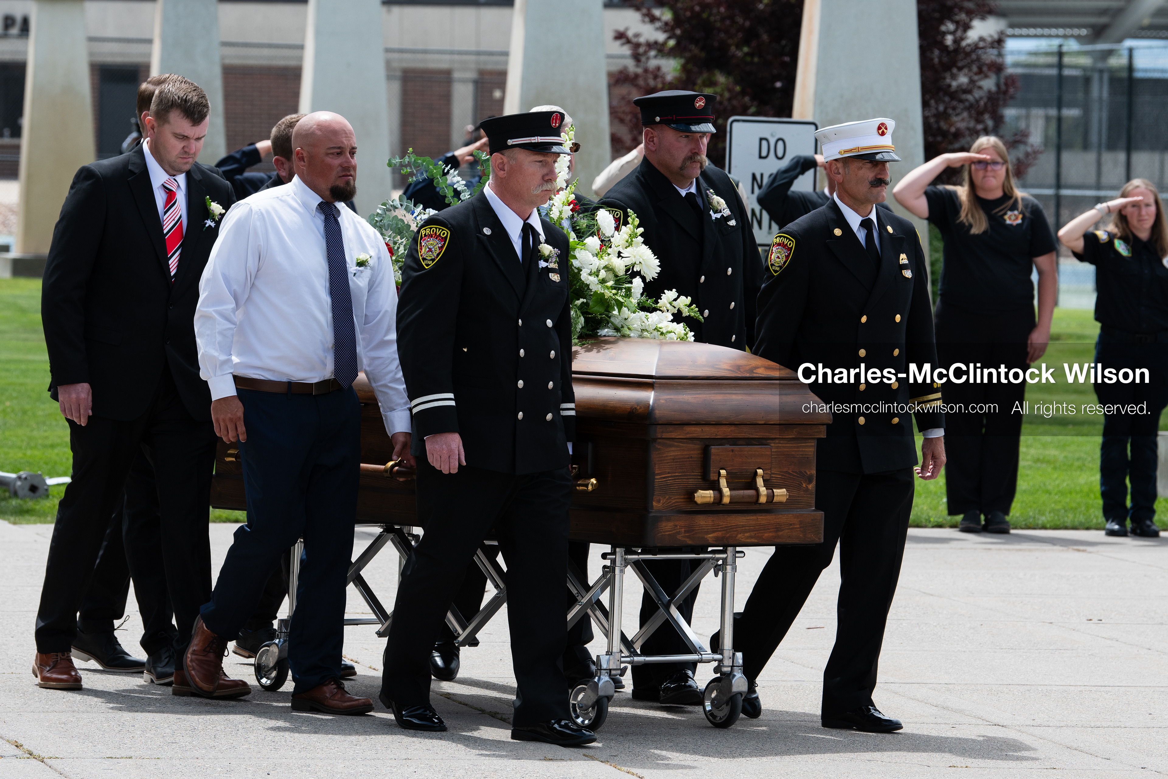 Firefighters and pallbearers escort the casket of Provo Fire Captain Spencer Long outside the UCCU Center on the campus of Utah Valley University in Orem, Utah, on Wednesday, July 29, 2026. More than 300 people came to the public memorial ceremony to honor Captain Long, his wife Katrina, and three of their sons, who died after a flash flood hit their campsite near the Sunglow Campground in Wayne County. (Photo by Charles-McClintock Wilson/Sipa USA)