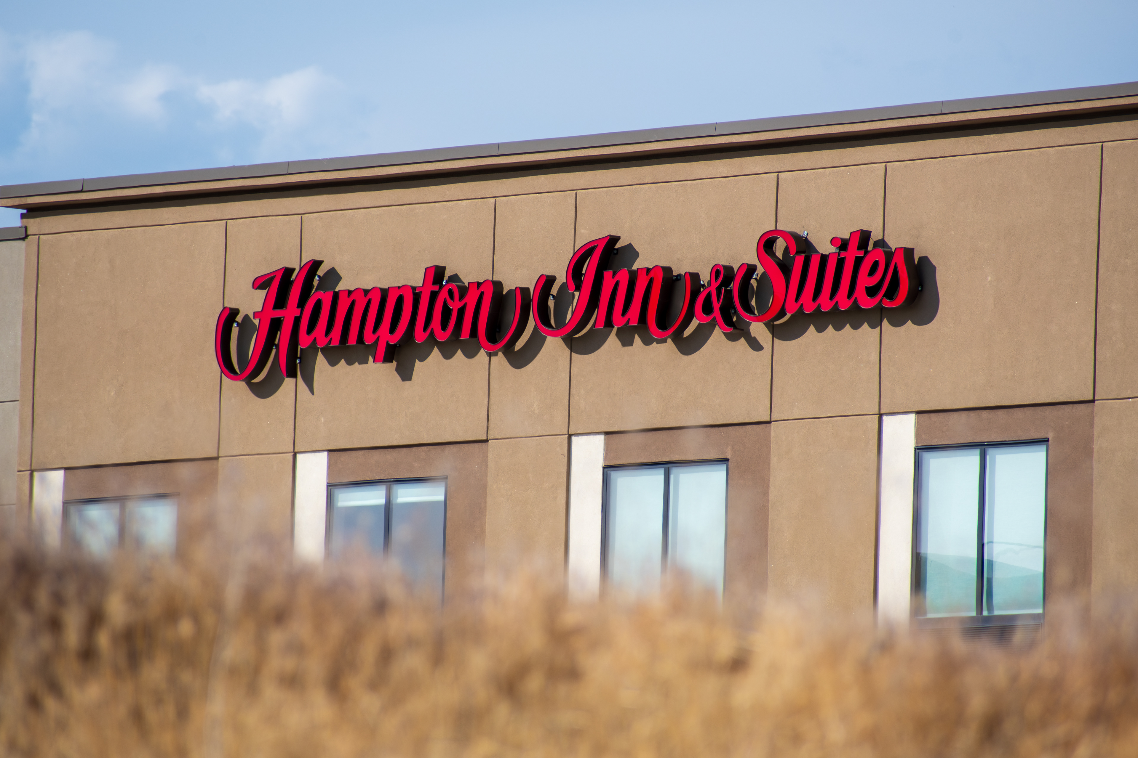 SPANISH FORK, UTAH, USA - JUNE 8, 2025: Exterior view of a Hampton Inn Hotel. Hampton Inn is an American chain of hotels trademarked by Hilton Worldwide.