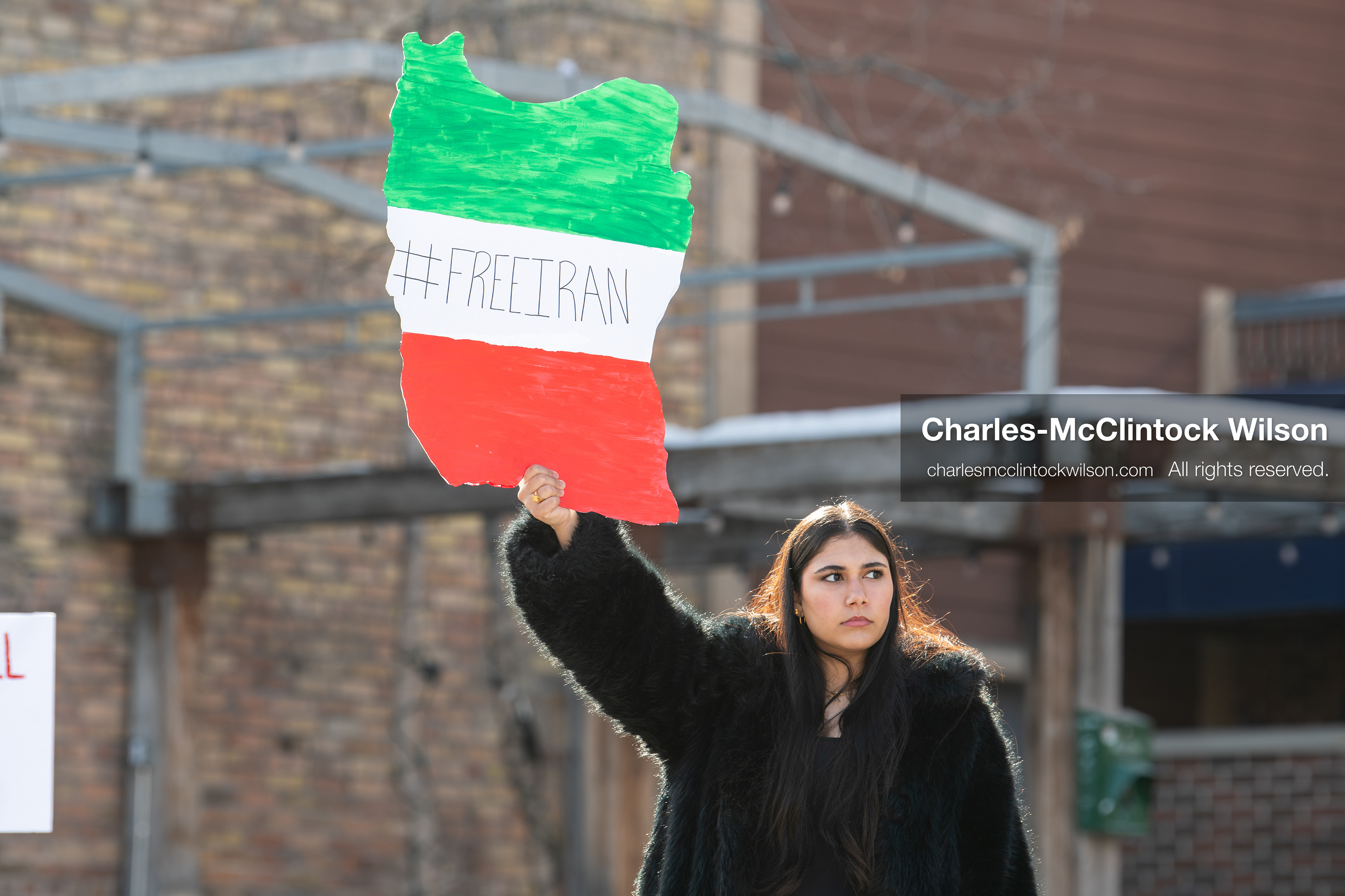 January 30, 2026, Park City, Utah, USA: A demonstrator holds a sign shaped like Iran during a small protest against the Iranian government on Main Street in Park City, Utah. (Credit Image: © Charles McClintock Wilson/ZUMA Press Wire)