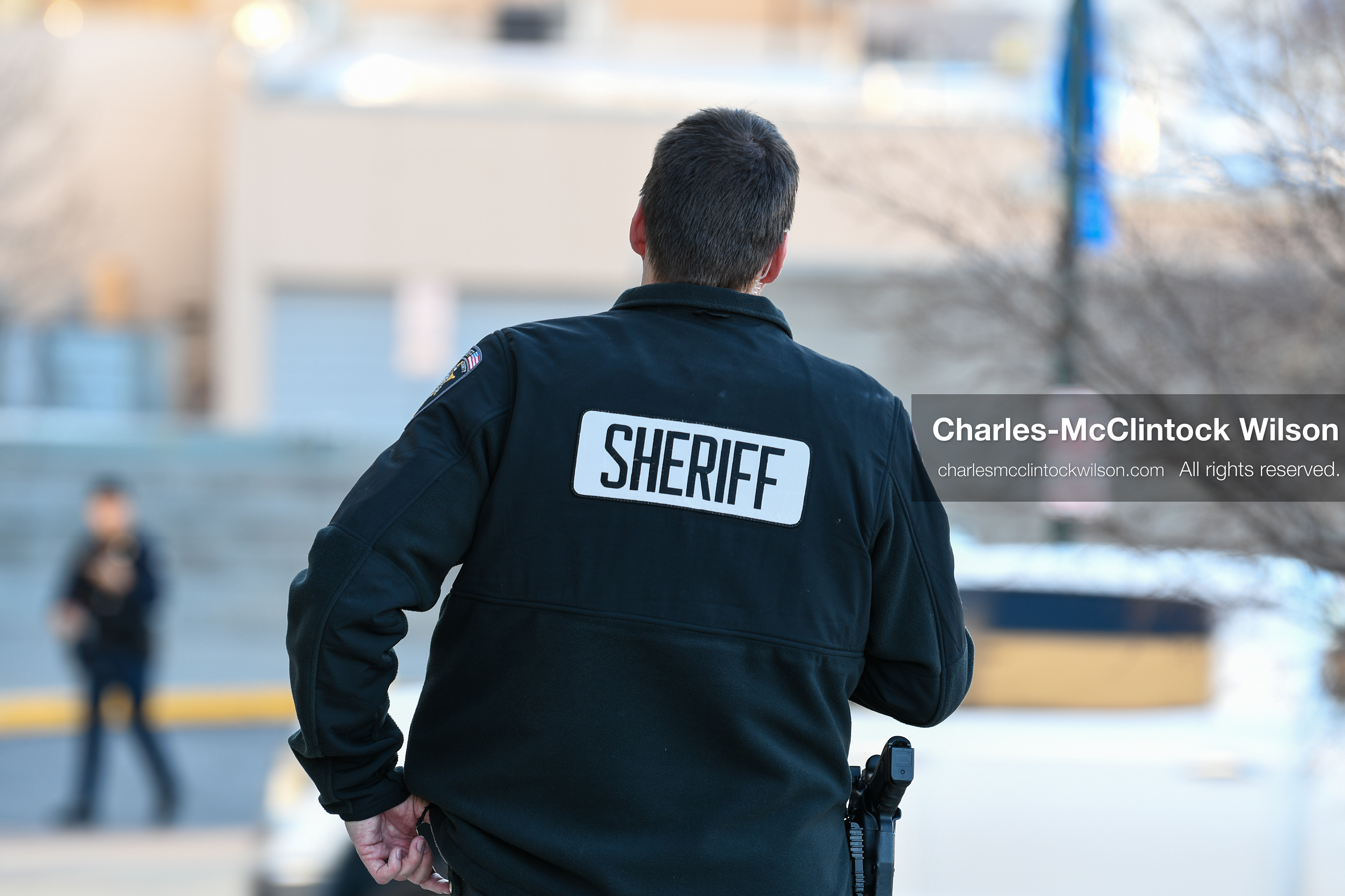 PROVO, UTAH, USA – DECEMBER 11, 2025: A Utah County Sheriff’s Office officer patrols the parking lot of the Fourth District Court in Provo during the first in‑person court appearance of Tyler Robinson in the Charlie Kirk murder case. (Credit Image: © Charles‑McClintock Wilson/ZUMA Press Wire)