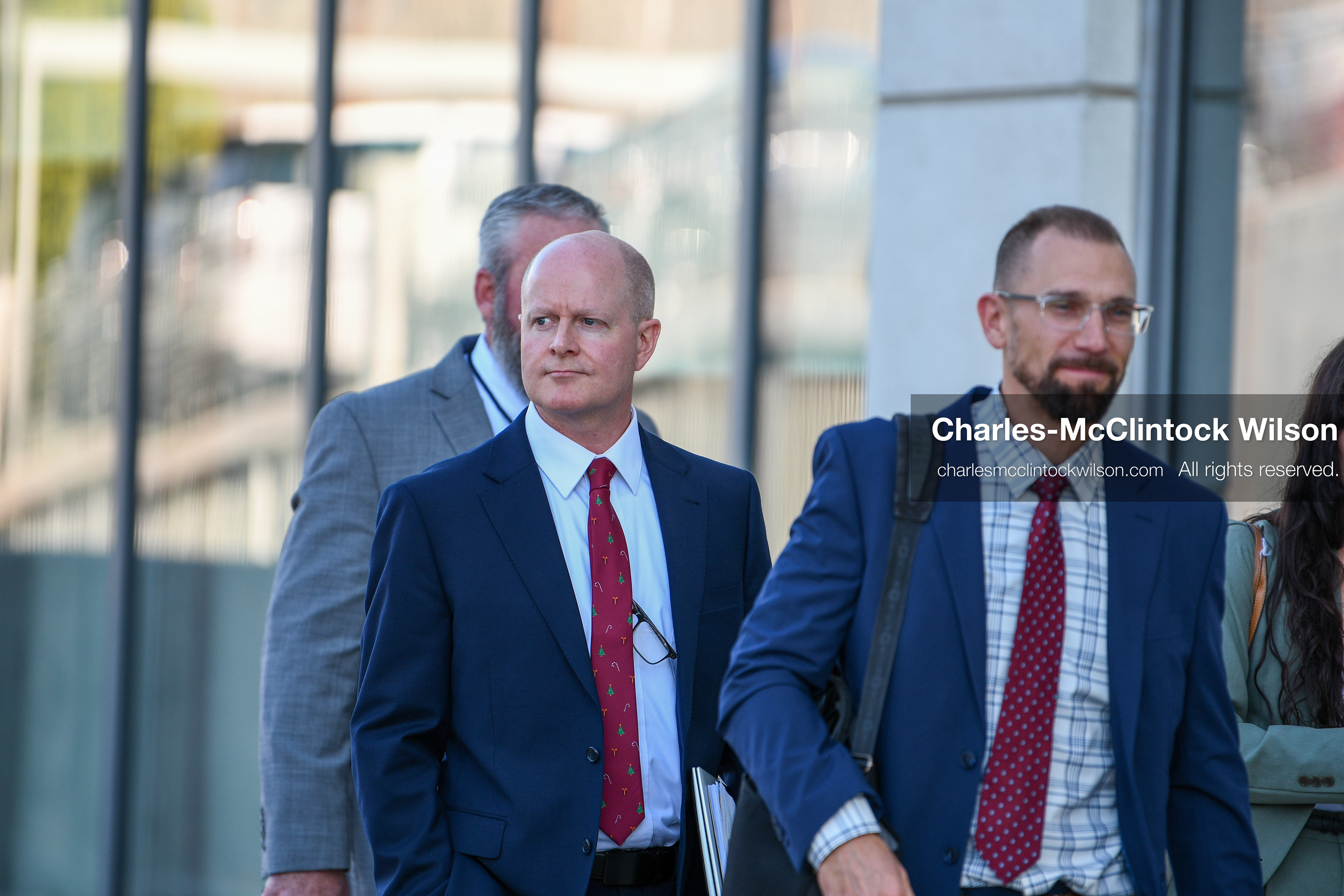 PROVO, UTAH, USA – DECEMBER 11, 2025: Chad Grunander, center, a prosecutor with the Utah County Attorney’s Office, arrives at the Fourth District Court in Provo for the first in‑person court appearance of Tyler Robinson in the Charlie Kirk murder case. (Credit Image: © Charles‑McClintock Wilson/ZUMA Press Wire)