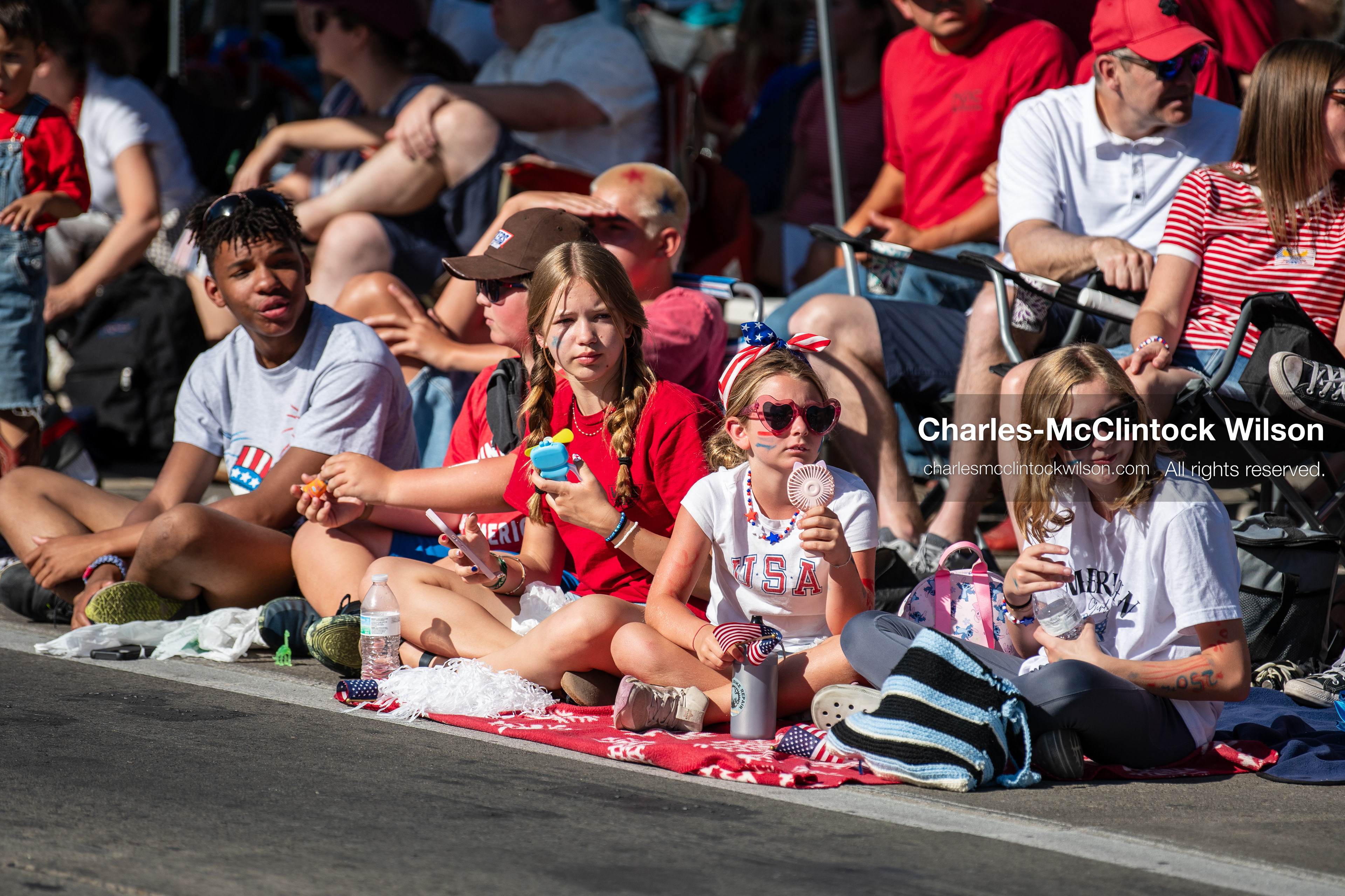 July 4, 2026, Provo, Utah, USA: Spectators and children gather along the sidewalk to watch America's Freedom Festival Grand Parade in Provo, Utah, Saturday, July 4, 2026. The annual Independence Day event features expanded programming to honor the 250th anniversary of United States independence. (Credit Image: © Charles-McClintock Wilson/ZUMA Press Wire)
