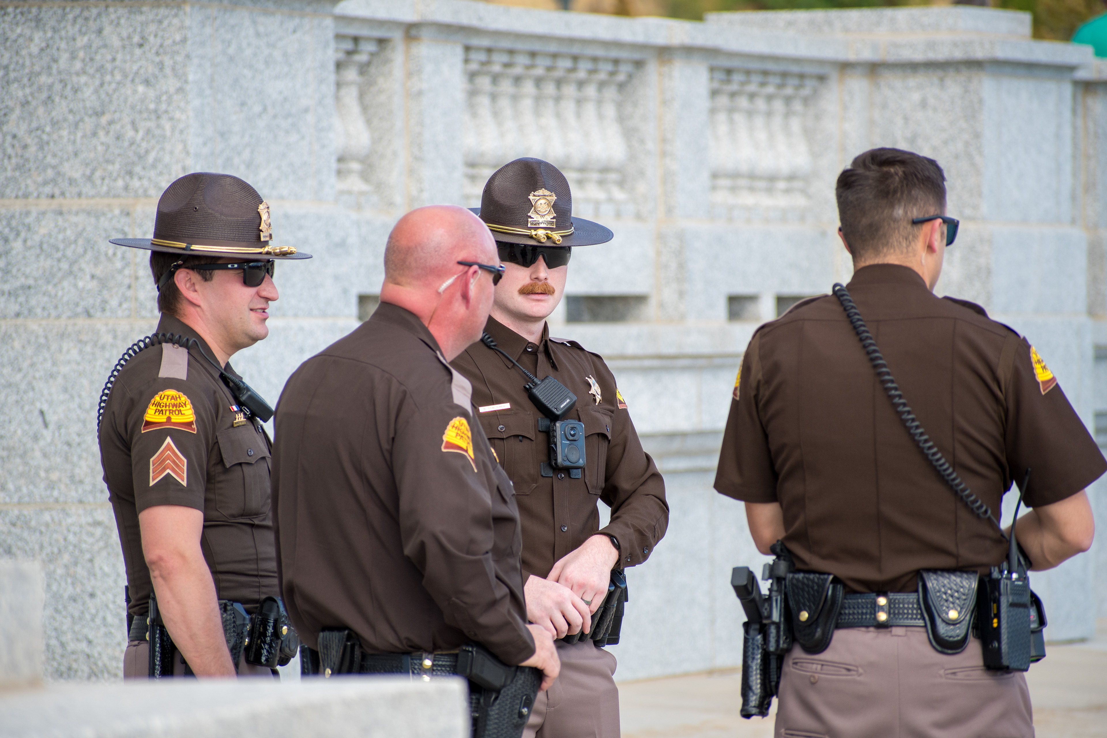 October 10, 2025, Salt Lake City, Utah, USA: Utah Highway Patrol officers stand near a stone structure during the Free Palestine Rally at the Utah State Capitol. The group appears to confer while equipped with standard gear. (Credit Image: © Charles-McClintock Wilson/ZUMA Press Wire)