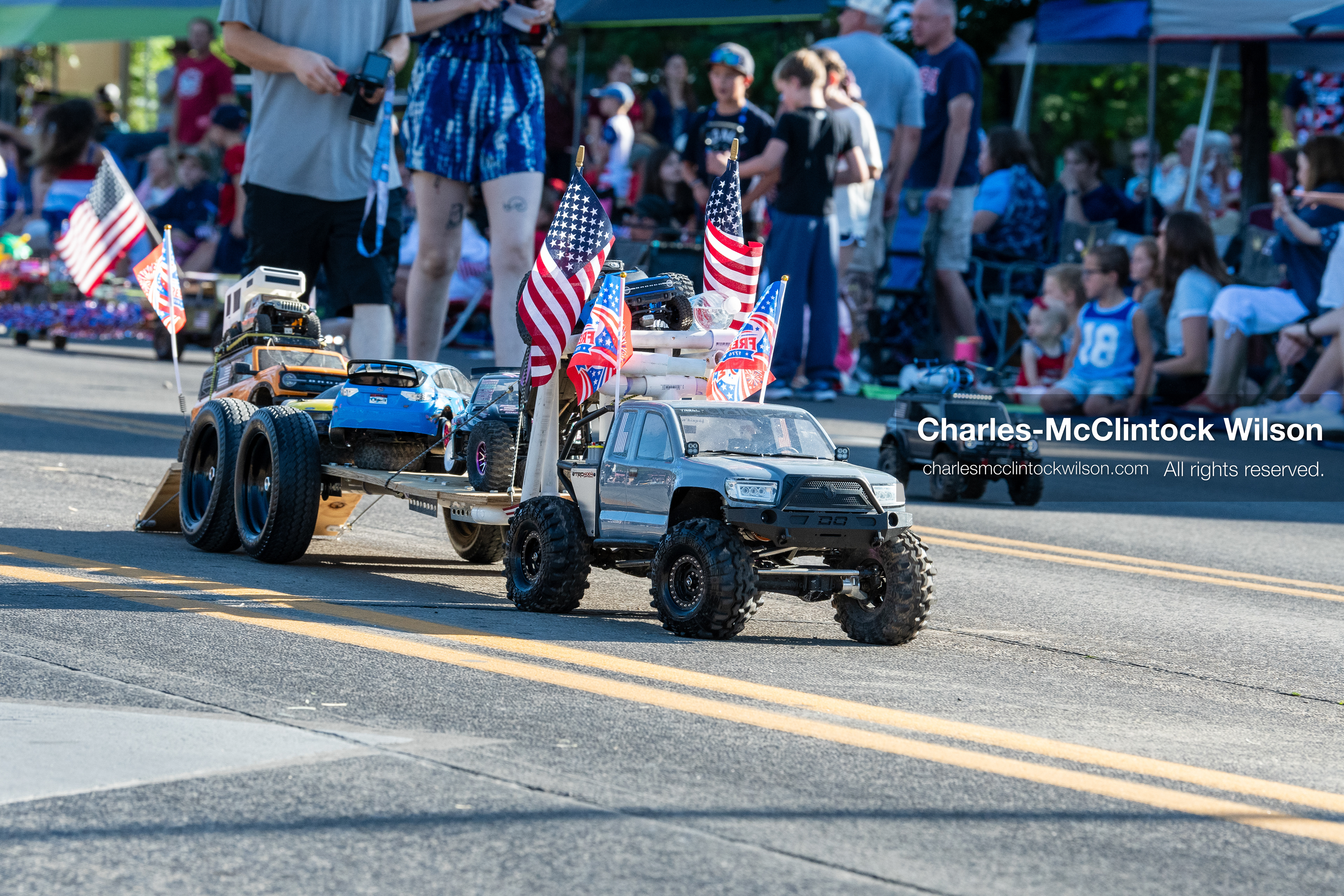 July 4, 2026, Provo, Utah, USA: A remote-controlled pickup truck decorated with small American flags tows a trailer carrying a second RC vehicle down the street during America's Freedom Festival Grand Parade in Provo, Utah, Saturday, July 4, 2026. The annual Independence Day event features expanded programming to honor the 250th anniversary of United States independence. (Credit Image: © Charles-McClintock Wilson/ZUMA Press Wire)