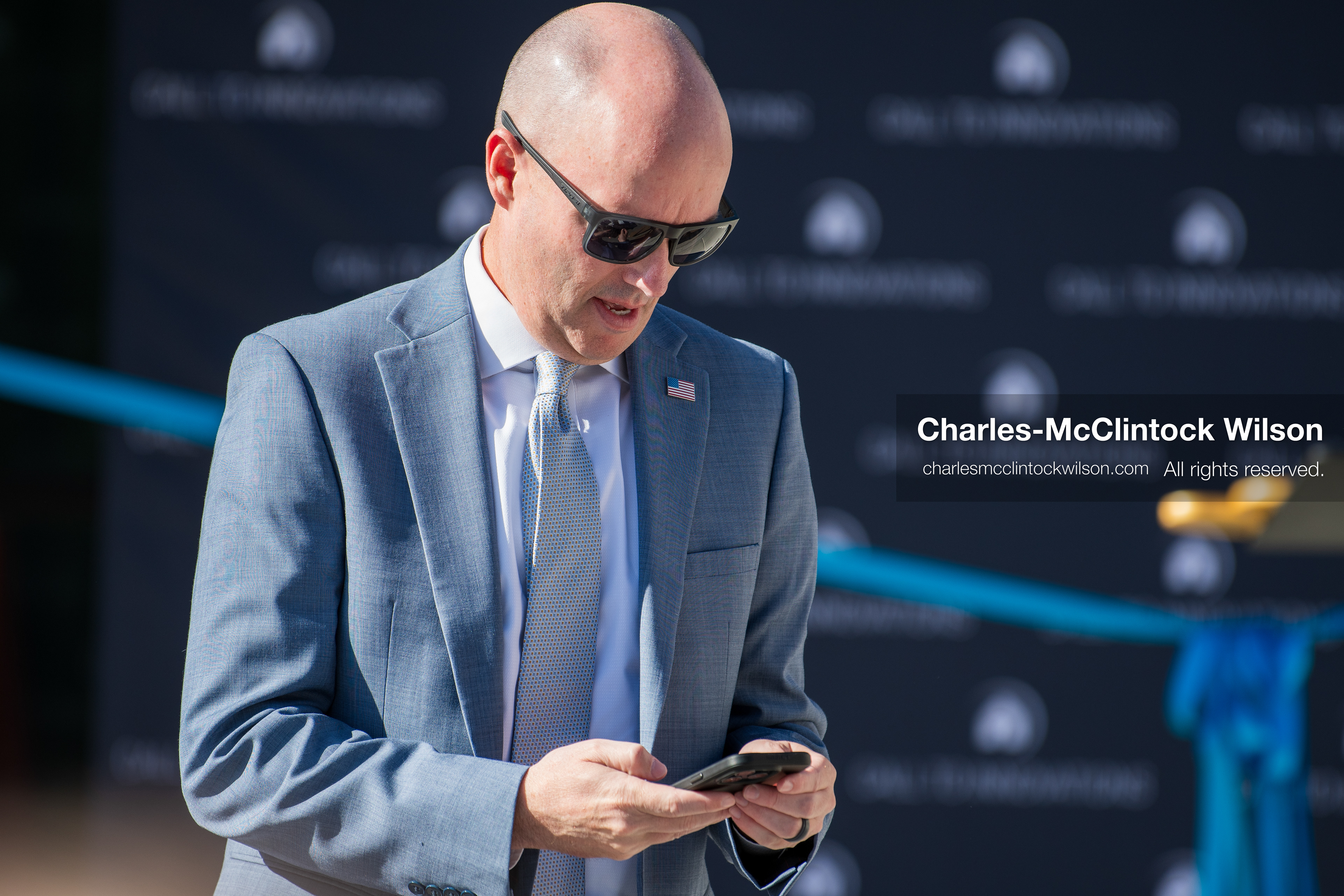 May 28, 2026, Lehi, Utah, USA: Utah Governor SPENCER COX checks his phone before the opening ceremony for Innovation Park at Holbrook Farms and the Lehi Rippy Literacy Center on May 28, 2026, in Lehi, Utah. (Credit Image: © Charles‑McClintock Wilson/ZUMA Press Wire)
