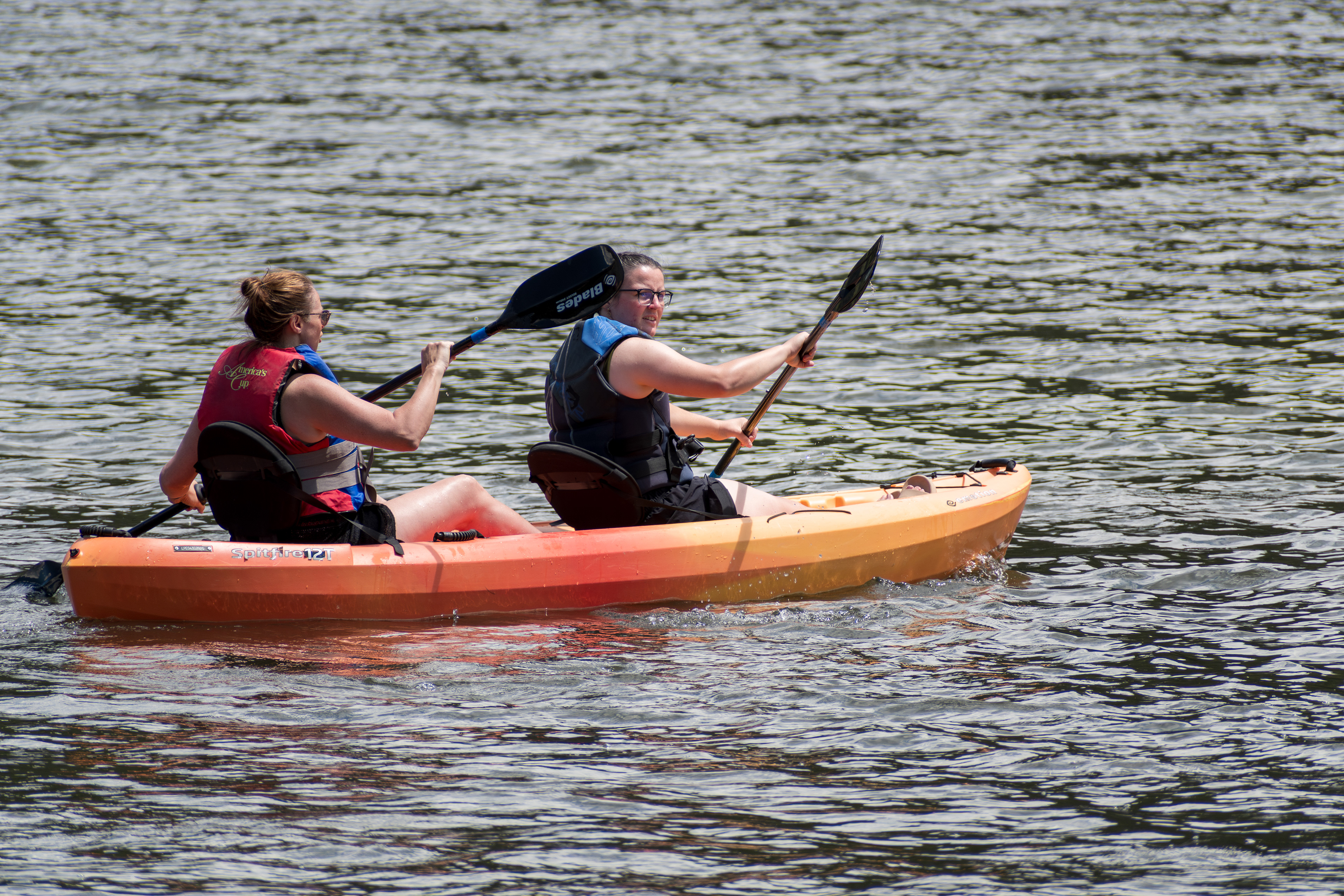 Summit County, Utah – July 20, 2025: People paddle kayaks across the calm waters of Smith and Morehouse Reservoir during a summer outing.