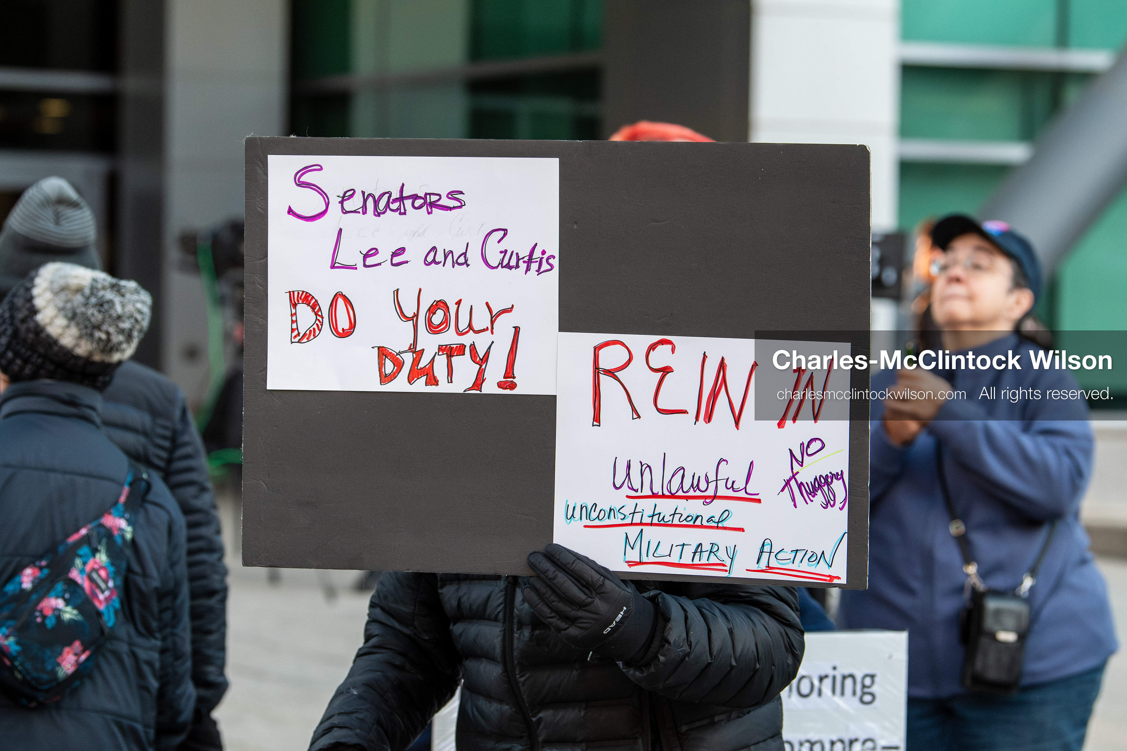 January 5, 2026, Salt Lake City, Utah, USA: A demonstrator holds a sign during a protest outside the Wallace Federal Building in Salt Lake City, Utah. The rally, organized by Salt Lake Indivisible, called for congressional limits on presidential war powers following recent US military actions in Venezuela involving the government of Nicolas Maduro. (Credit Image: (c) Charles‑McClintock Wilson/ZUMA Press Wire)