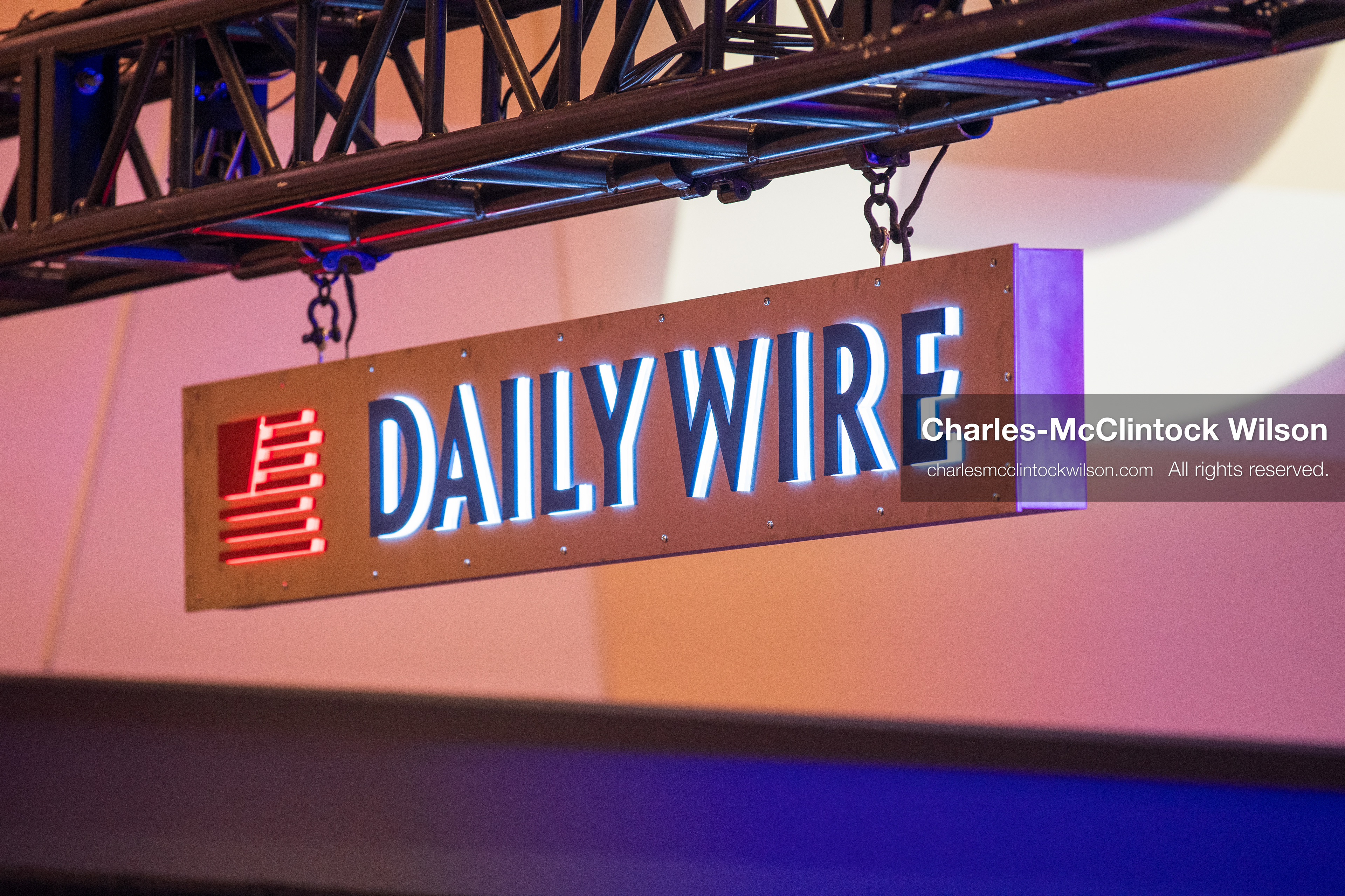 December 18, 2025, Phoenix, Arizona, USA: A suspended DailyWire sign glows above the media zone at AmericaFest 2025 inside the Phoenix Convention Center, the first edition of the event held since the death of Charlie Kirk. (Credit Image: (c) Charles-McClintock Wilson/ZUMA Press Wire)