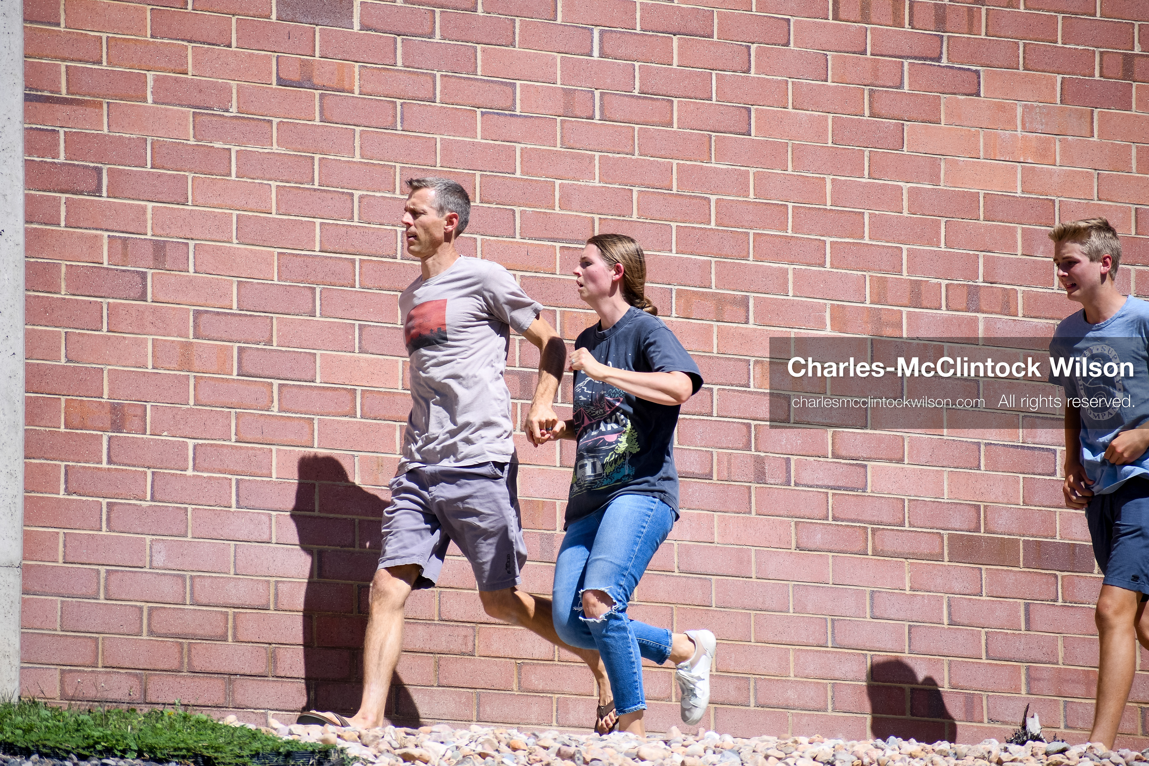 September 10, 2025, Orem, Utah, USA: Attendees flee the scene moments after conservative activist Charlie Kirk is shot during a public event at Utah Valley University. The shooting occurs during a Q&A session with students, approximately two minutes into the exchange. Kirk appears to be struck in the neck. The campus is evacuated as emergency protocols are activated. A university spokesperson states that no suspect is in custody at the time, though an earlier campus alert indicated that police had detained an individual. (Credit Image: © Charles-McClintock Wilson/ZUMA Press Wire)