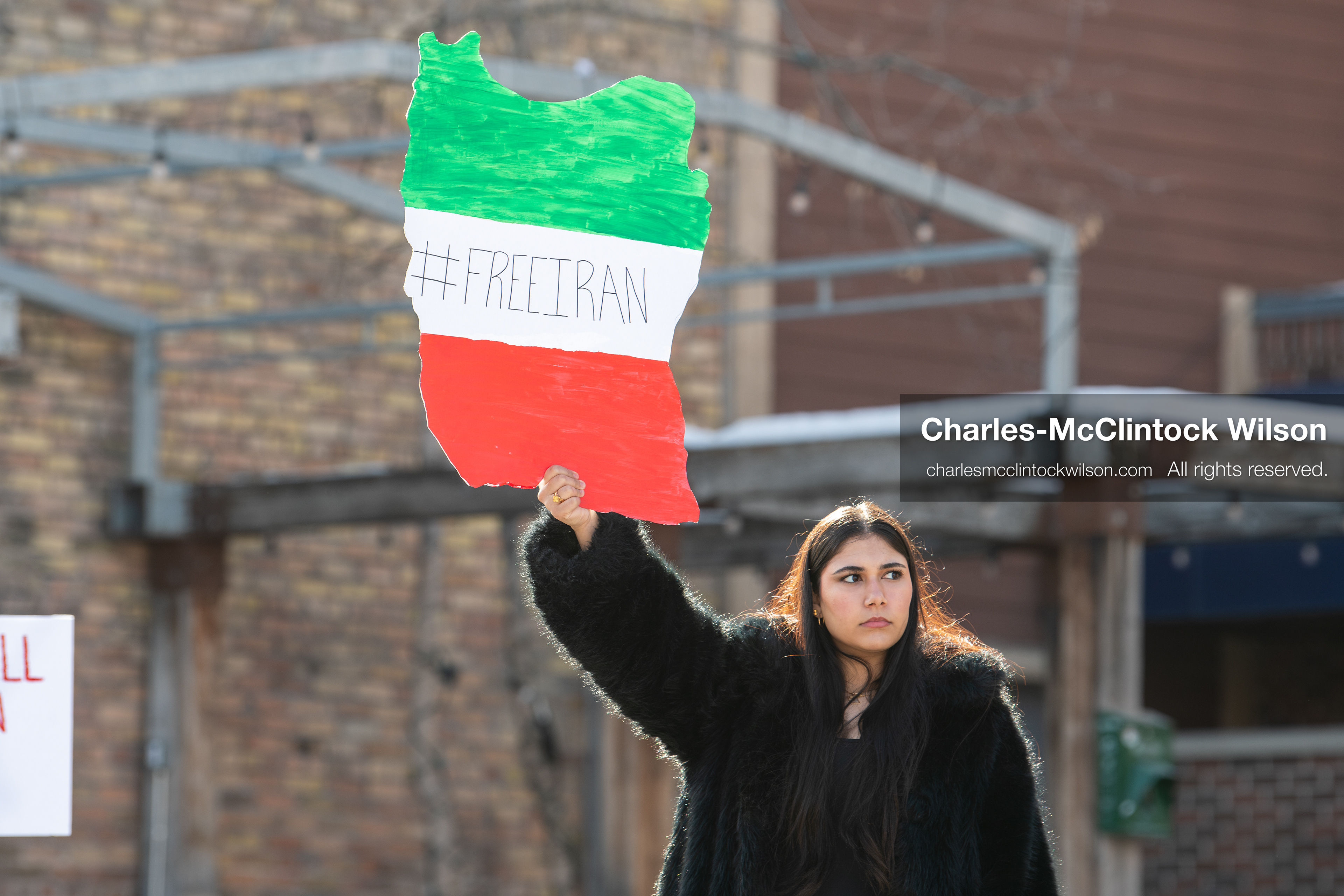 January 30, 2026, Park City, Utah, USA: A demonstrator holds a sign shaped like Iran during a small protest against the Iranian government on Main Street in Park City, Utah. (Credit Image: © Charles McClintock Wilson/ZUMA Press Wire)