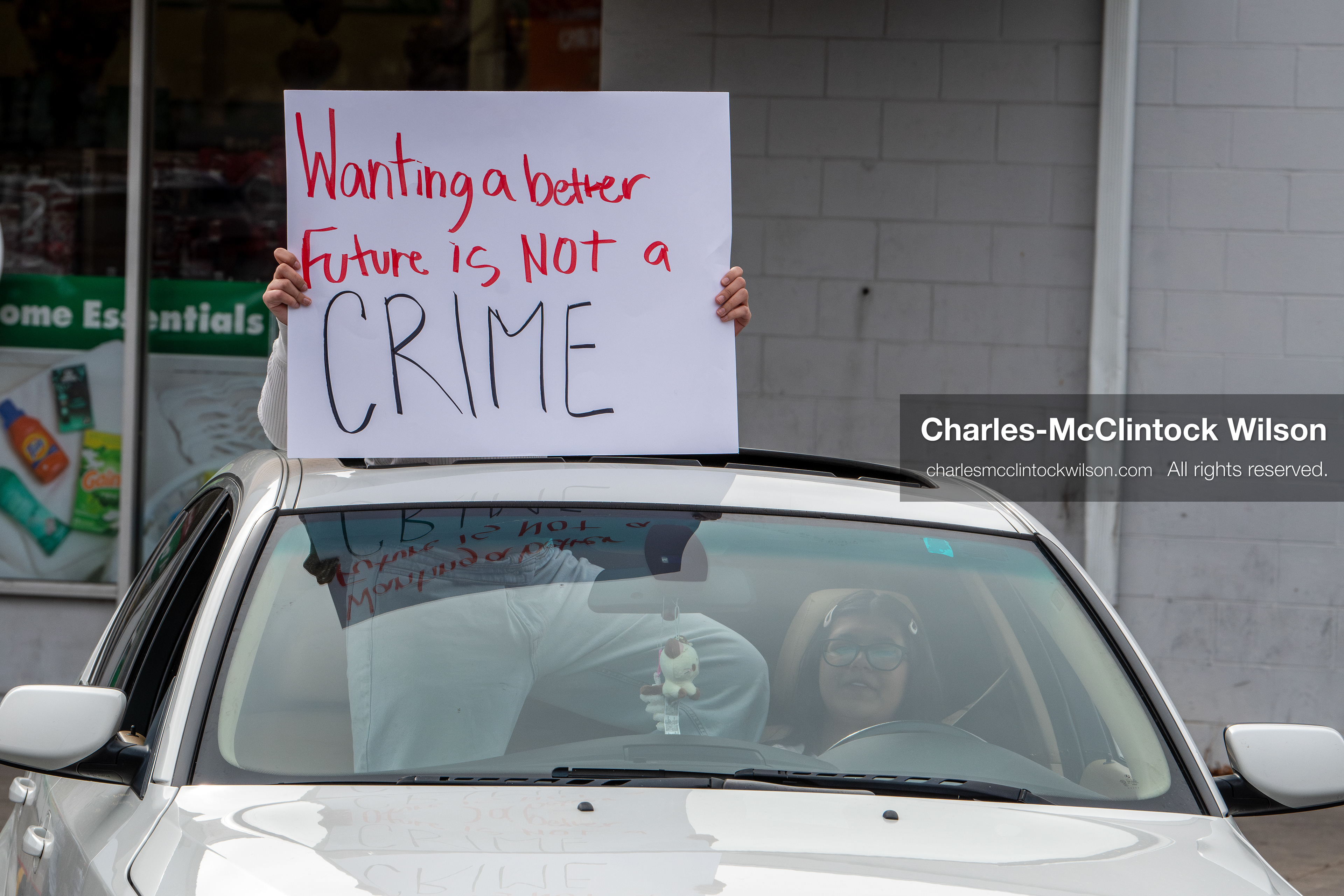 February 11, 2026, Orem, Utah, USA: A student leans out of a car window while participating in a student‑led protest involving participants from multiple Orem schools. (Credit Image: © Charles‑McClintock Wilson/ZUMA Press Wire)
