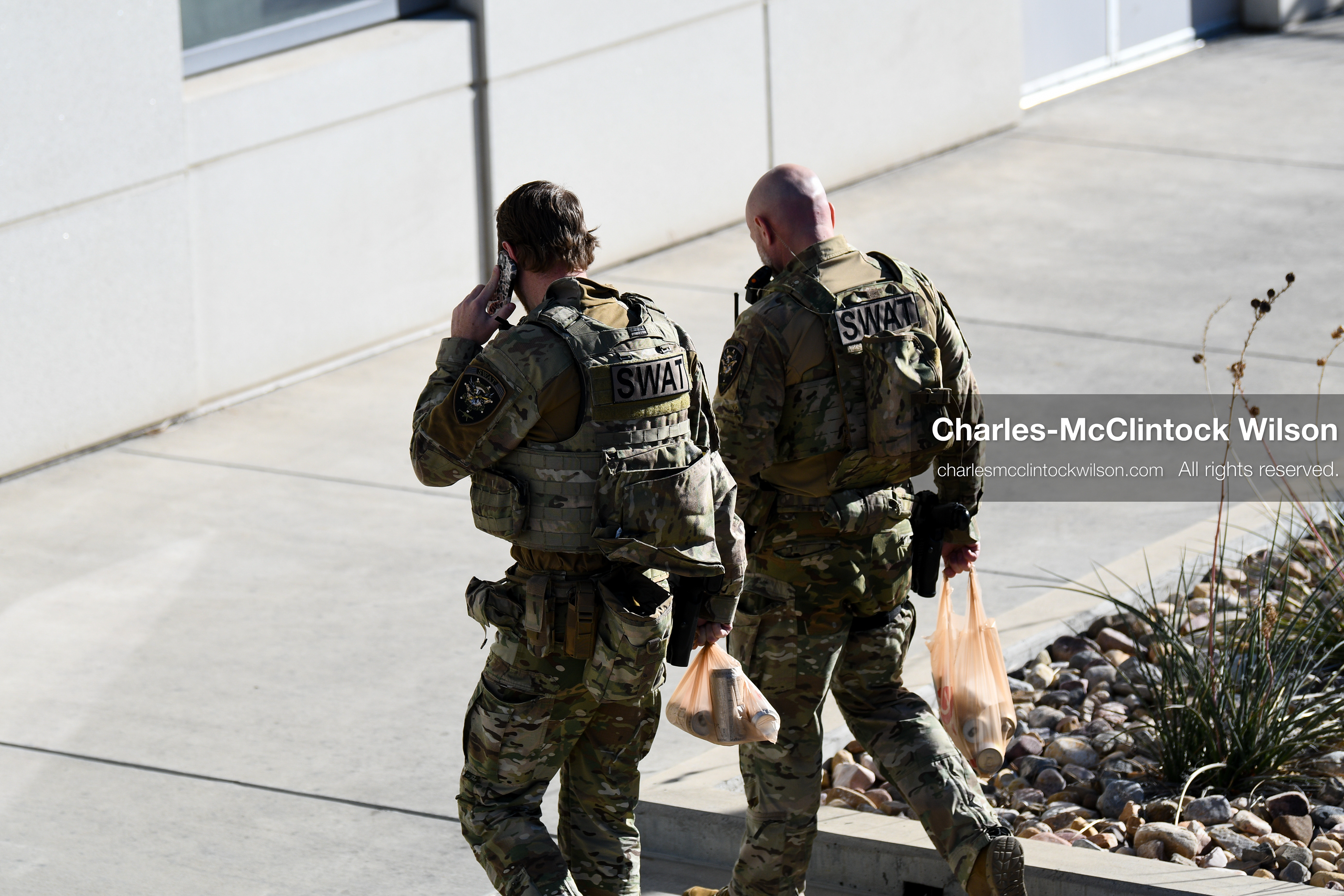 PROVO, UTAH, USA – DECEMBER 11, 2025: Two SWAT members walk near the Fourth District Court in Provo during the first in‑person court appearance of Tyler Robinson in the Charlie Kirk murder case. (Credit Image: © Charles‑McClintock Wilson/ZUMA Press Wire)