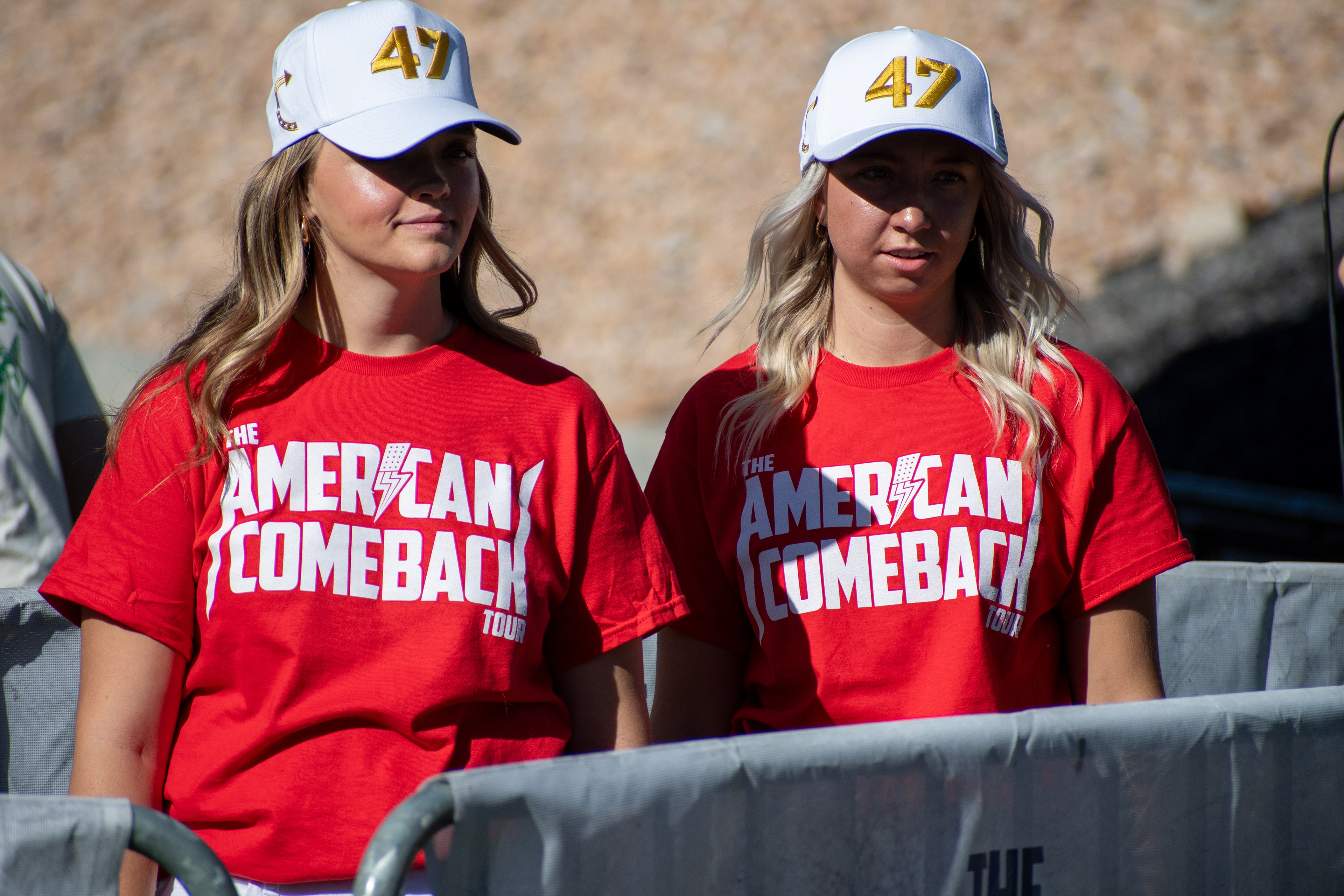 OREM, UTAH – SEPTEMBER 10, 2025: Two attendees stand together at Utah Valley University during the opening stop of the American Comeback Tour. Wearing matching red shirts and white caps marked “47,” the individuals reflect a moment of coordinated presence and thematic clarity. The image captures the visual rhythm and communal energy that shaped the atmosphere of the day. © Charles-McClintock Wilson / ZUMA Press