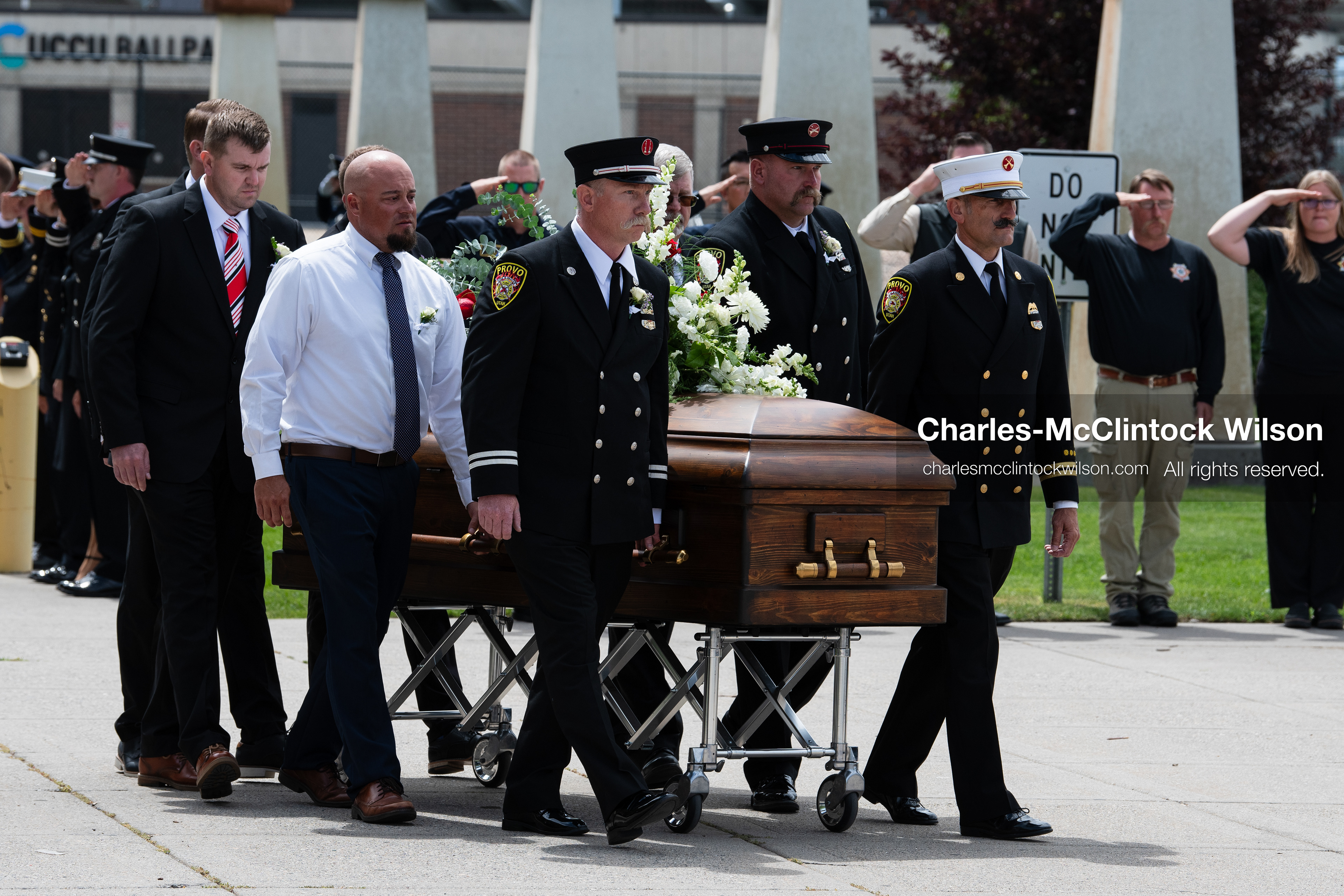 Firefighters and pallbearers escort the casket of Provo Fire Captain Spencer Long outside the UCCU Center on the campus of Utah Valley University in Orem, Utah, on Wednesday, July 29, 2026. More than 300 people came to the public memorial ceremony to honor Captain Long, his wife Katrina, and three of their sons, who died after a flash flood hit their campsite near the Sunglow Campground in Wayne County. (Photo by Charles-McClintock Wilson/Sipa USA)