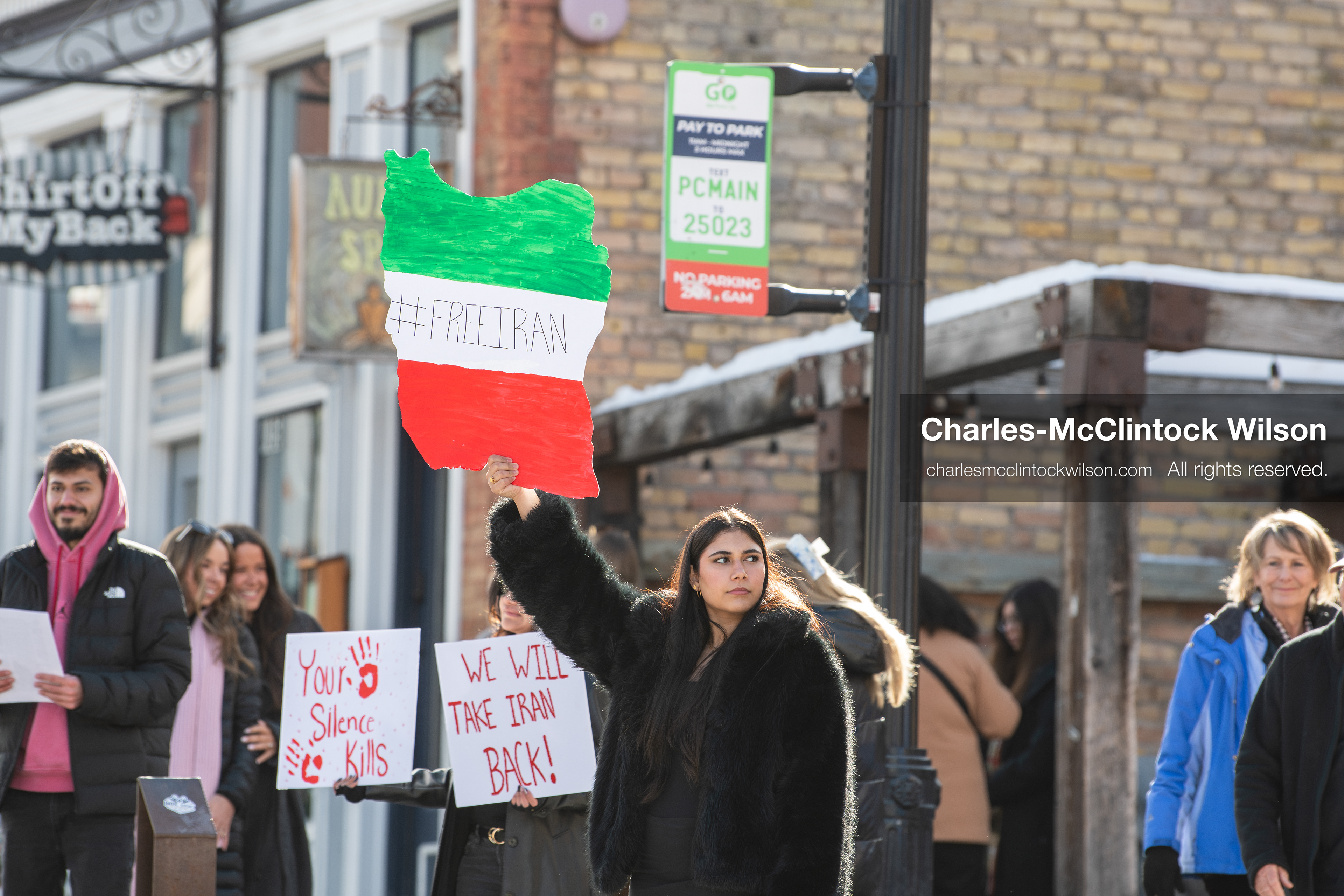 January 30, 2026, Park City, Utah, USA: Demonstrators hold signs during a small protest against the Iranian government on Main Street in Park City, Utah. (Credit Image: © Charles McClintock Wilson/ZUMA Press Wire)
