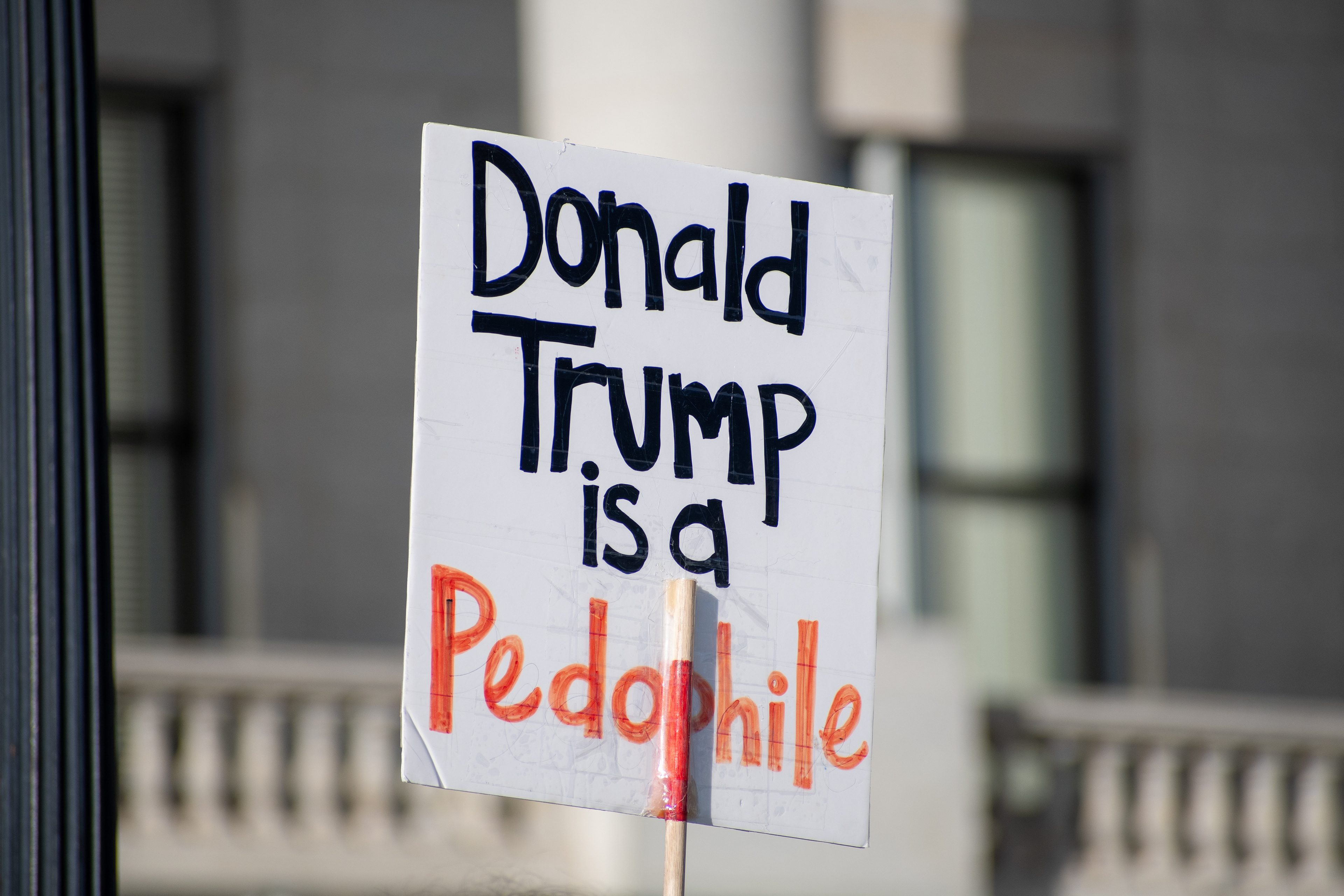 October 10, 2025, Salt Lake City, Utah, USA: Protesters gather during the Free Palestine Rally organized in front of the Utah State Capitol. One participant holds a sign with a political message critical of President Donald Trump. (Credit Image: © Charles-McClintock Wilson/ZUMA Press Wire)