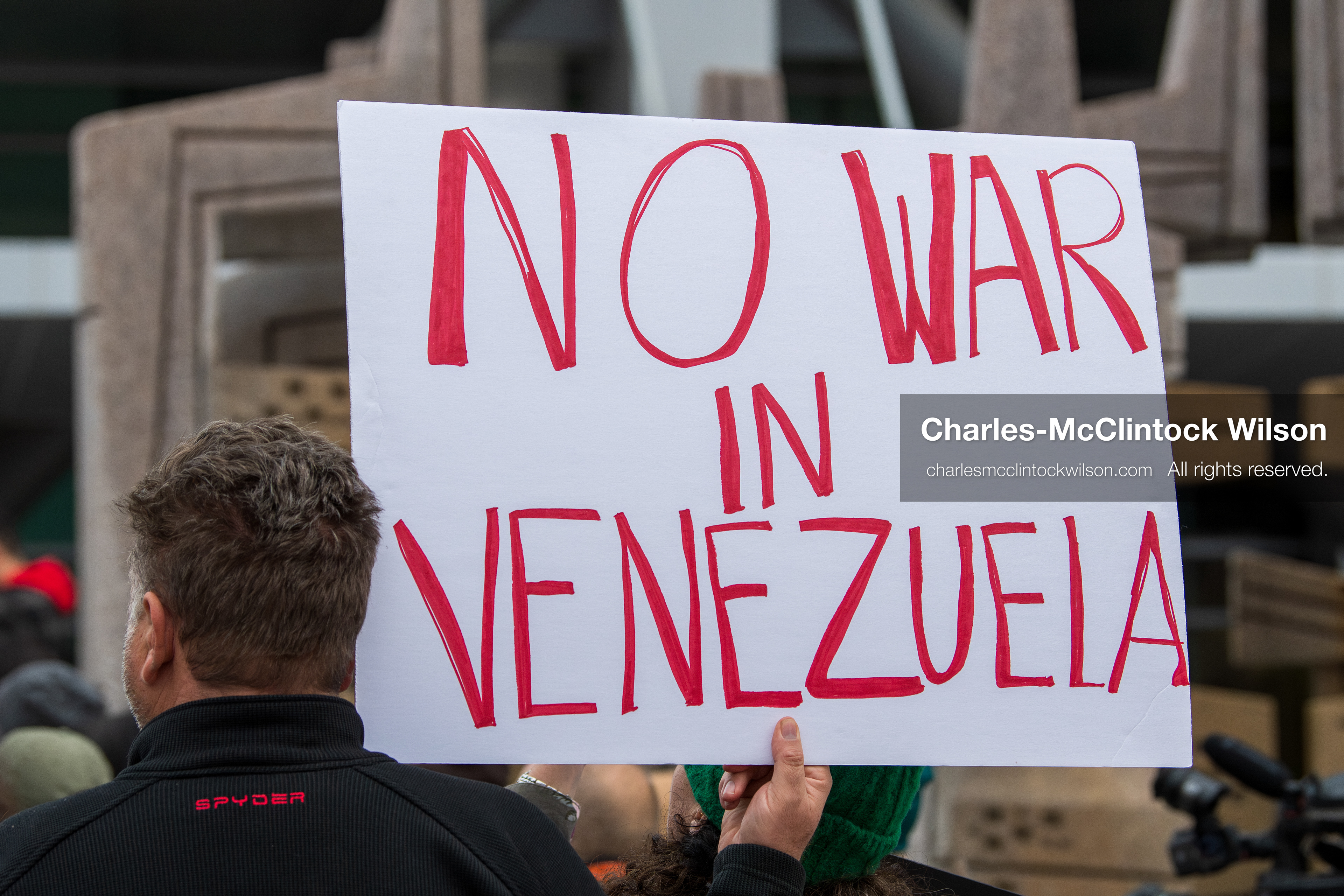 January 3, 2026, Salt Lake City, Utah, USA: A protester holds a sign during a demonstration against US action in Venezuela outside the Wallace Federal Building in Salt Lake City, Utah. The protest was part of a nationwide mobilization responding to recent military developments. (Credit Image: (c) Charles‑McClintock Wilson/ZUMA Press Wire)