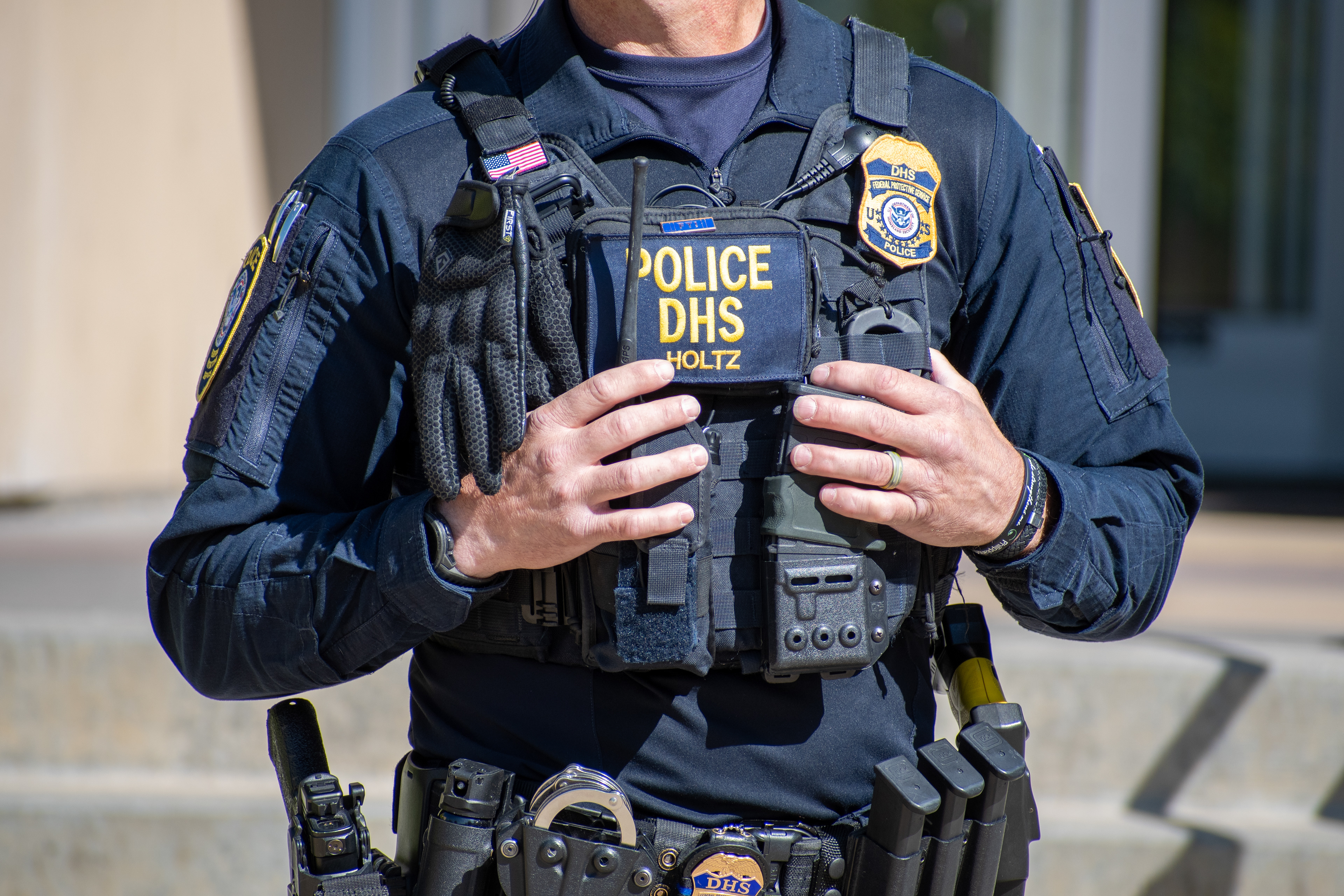September 15, 2025 – Provo, Utah, United States: A Homeland Security police officer adjusts tactical gear outside the Utah Valley Convention Center during a Department of Homeland Security career expo focused on recruiting law enforcement and security personnel. Photograph by Charles‑McClintock Wilson / ZUMA Press Wire