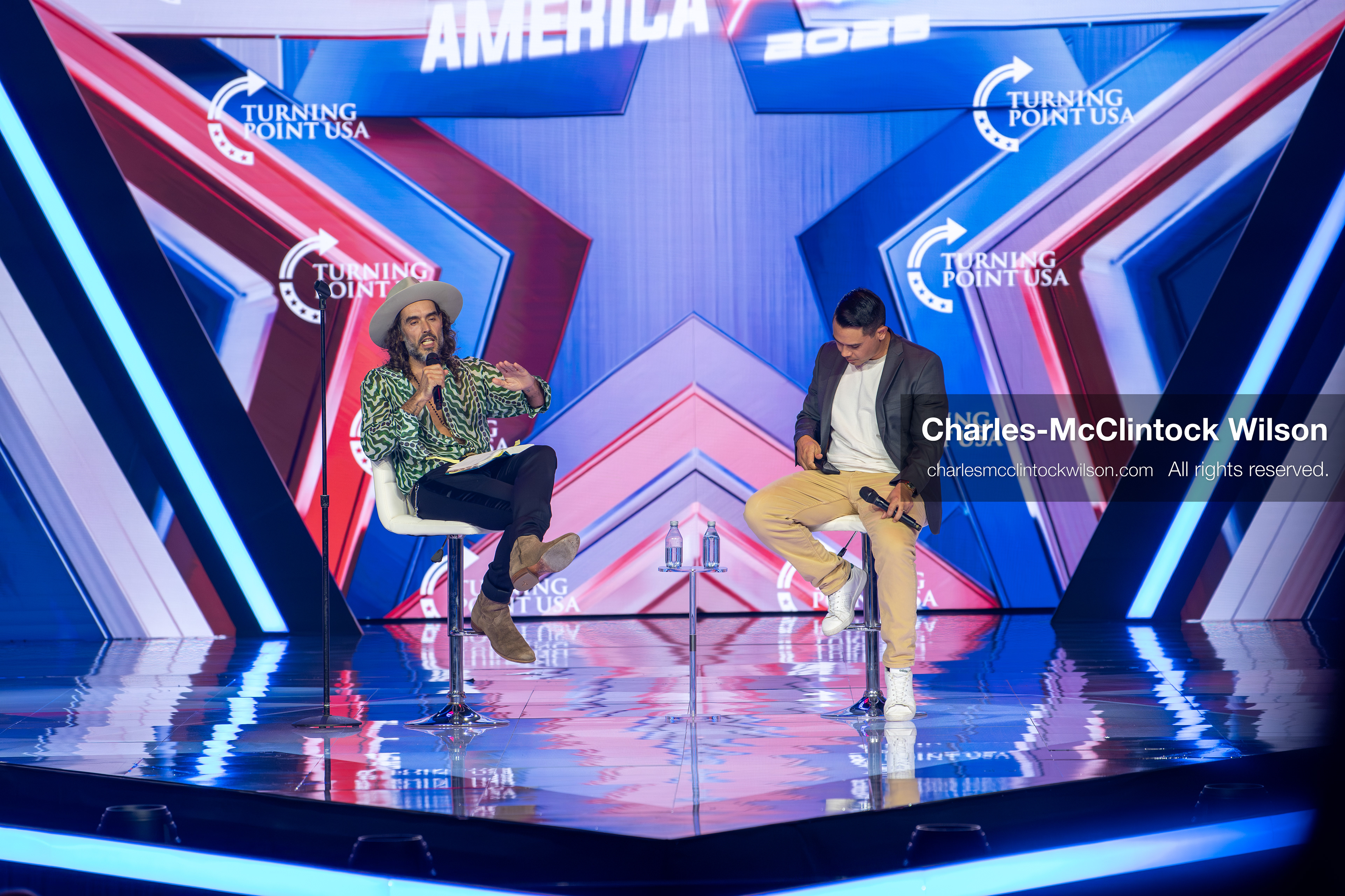 December 18, 2025, Phoenix, Arizona, USA: Russell Brand speaks during Day One of Turning Point USA’s AmericaFest 2025 at the Phoenix Convention Center in Phoenix, Arizona.   (Credit Image: © Charles‑McClintock Wilson/ZUMA Press Wire)