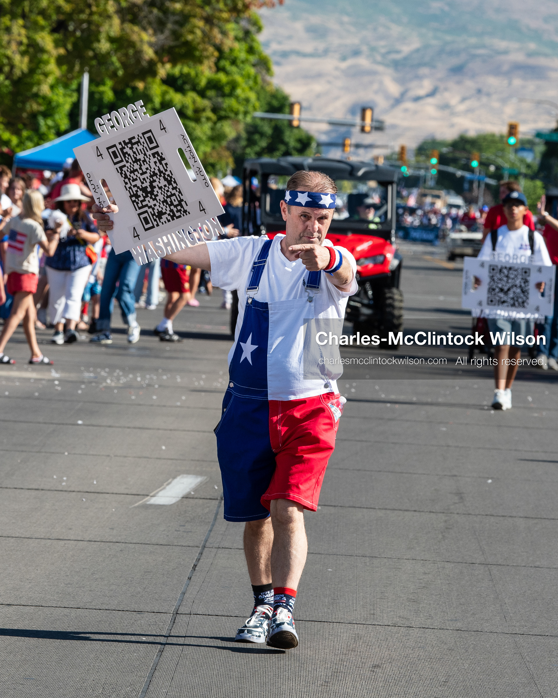 July 4, 2026, Provo, Utah, USA: A parade participant walks down the middle of the empty street ahead of incoming entries during America's Freedom Festival Grand Parade in Provo, Utah, Saturday, July 4, 2026. The annual event drew thousands of spectators to the downtown corridor. (Credit Image: © Charles-McClintock Wilson/ZUMA Press Wire)