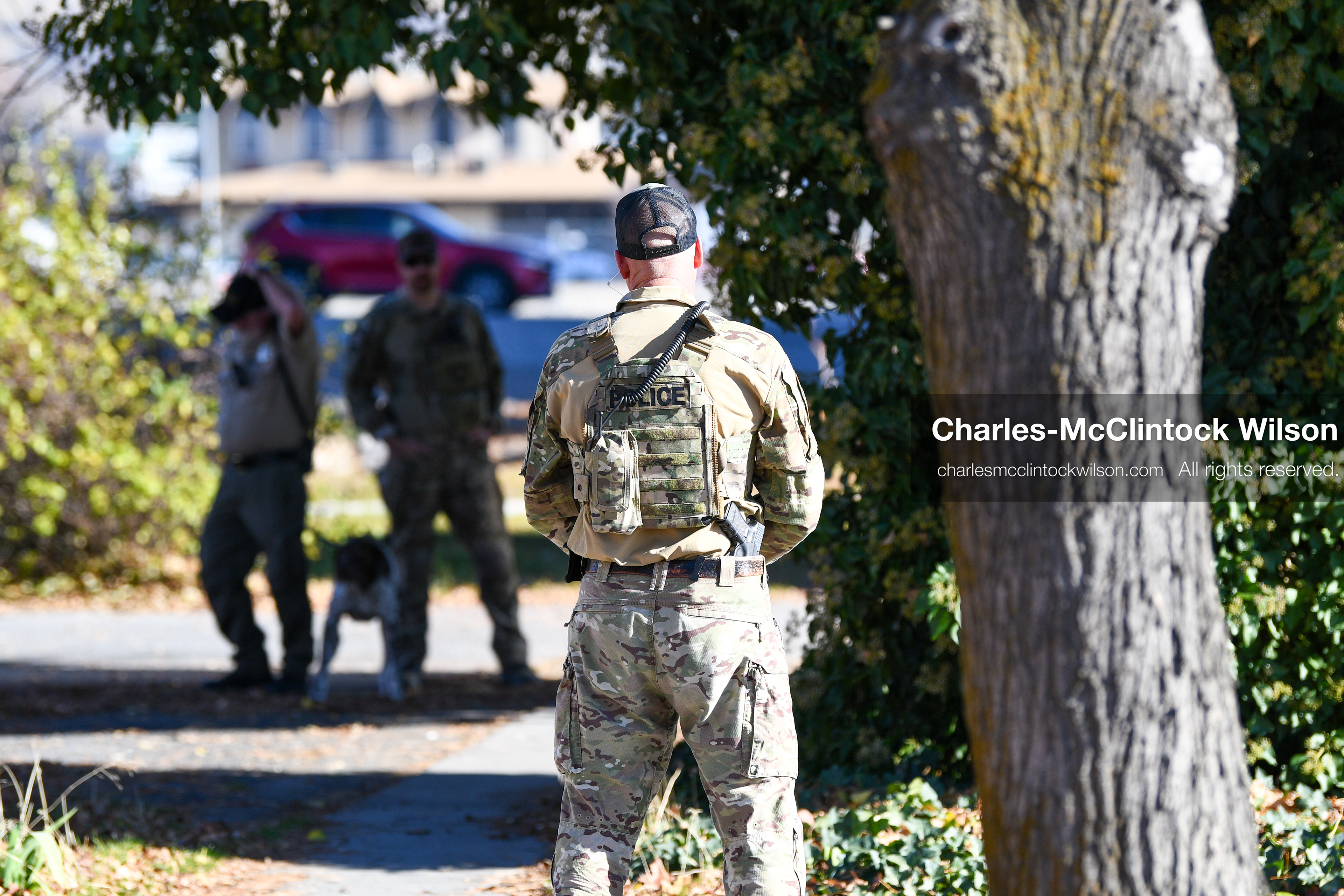 PROVO, UTAH, USA – DECEMBER 11, 2025: Police officers investigate a suspicious package with a K‑9 unit near the Fourth District Court in Provo during the first in‑person court appearance of Tyler Robinson in the Charlie Kirk murder case. (Credit Image: © Charles‑McClintock Wilson/ZUMA Press Wire)