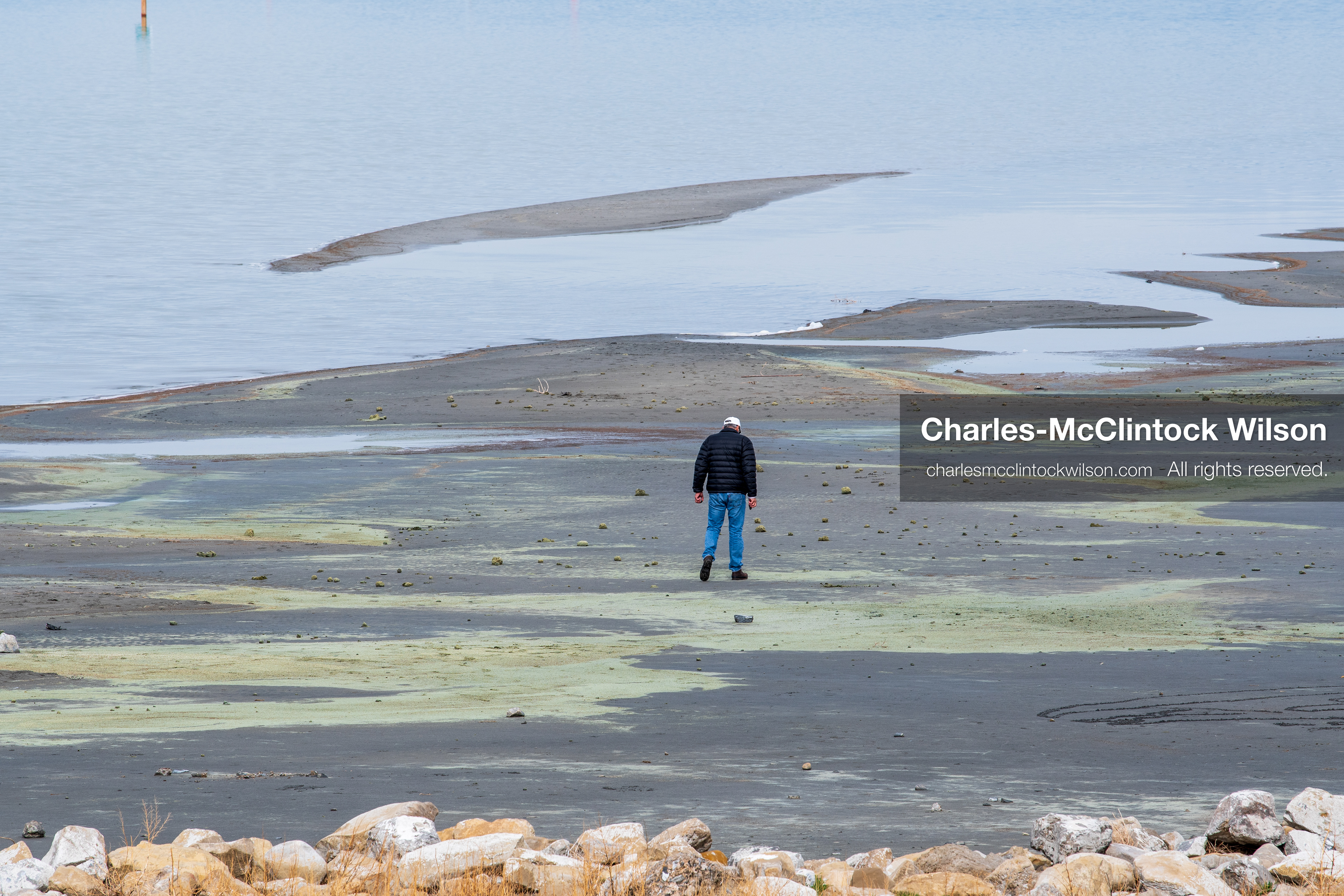 March 1, 2026, Great Salt Lake, Utah, USA: A person walks along the exposed shoreline of the Great Salt Lake as water levels in the region remain historically low. Reports from state officials and the Great Salt Lake Strike Team state that the lake continues to fall within a serious adverse‑effects range, with elevations among the lowest recorded in more than one hundred years. The lake has drawn increased public attention as lawmakers consider large‑scale water projects and long‑term plans to address declining conditions. (Credit Image: © Charles‑McClintock Wilson/ZUMA Press Wire)