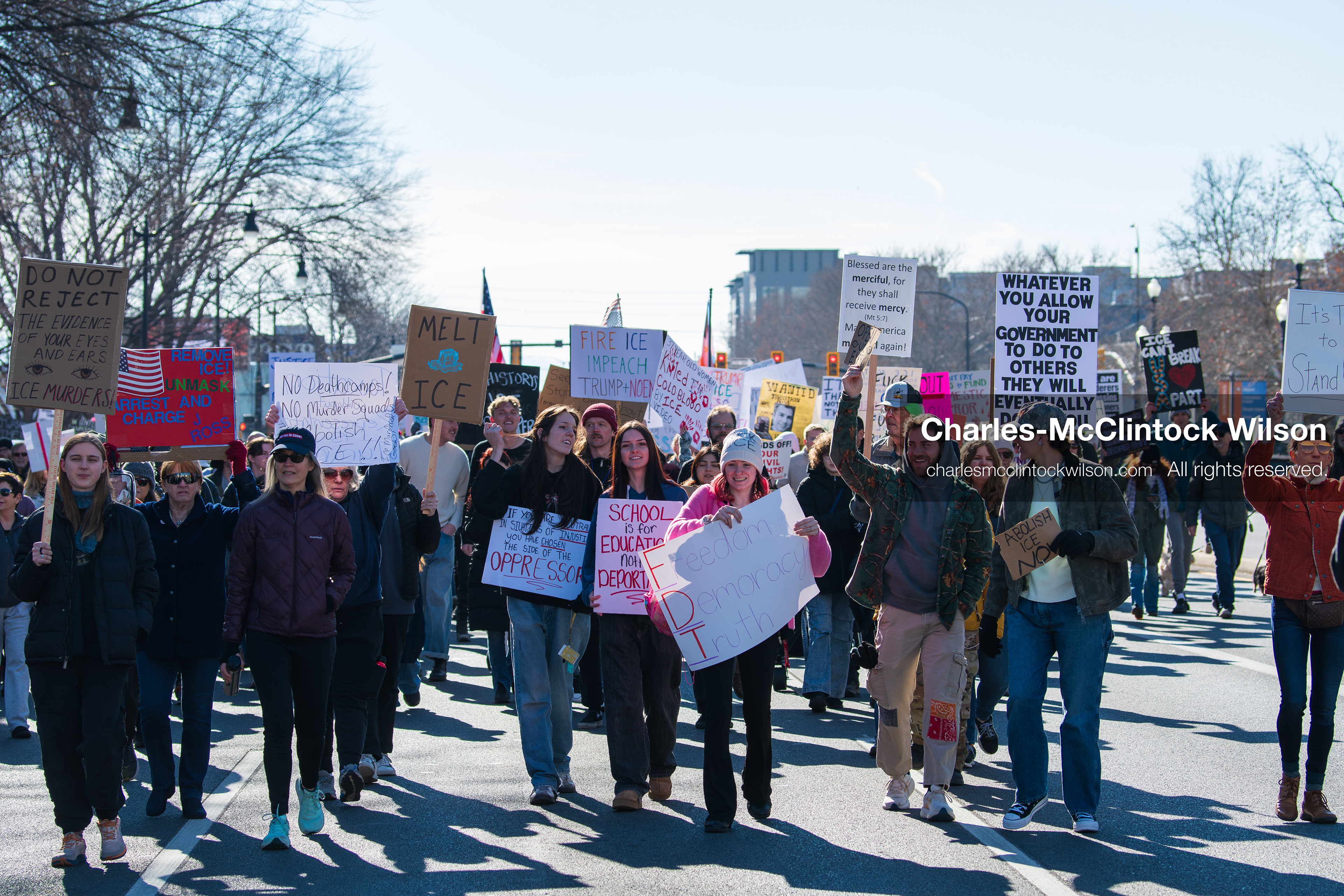 Salt Lake City, Utah, January 10, 2026: A group of demonstrators marches through downtown Salt Lake City during the ICE Out for Good protest, which began at Washington Square Park, with participants carrying signs and personal items as they walk together. (Credit Image: © Charles‑McClintock Wilson/ZUMA Press Wire)