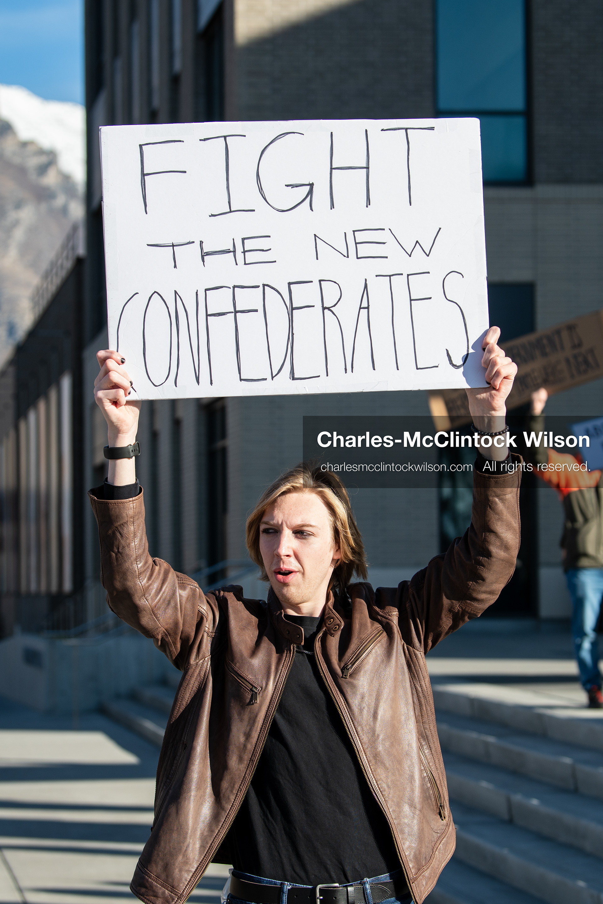 January 20, 2026, Provo, Utah, USA: A demonstrator stands outside Provo City Hall during the Free America Walkout protest in Provo Utah on January 20 2026. The nationwide event called for immigration reform and changes to detention practices. 