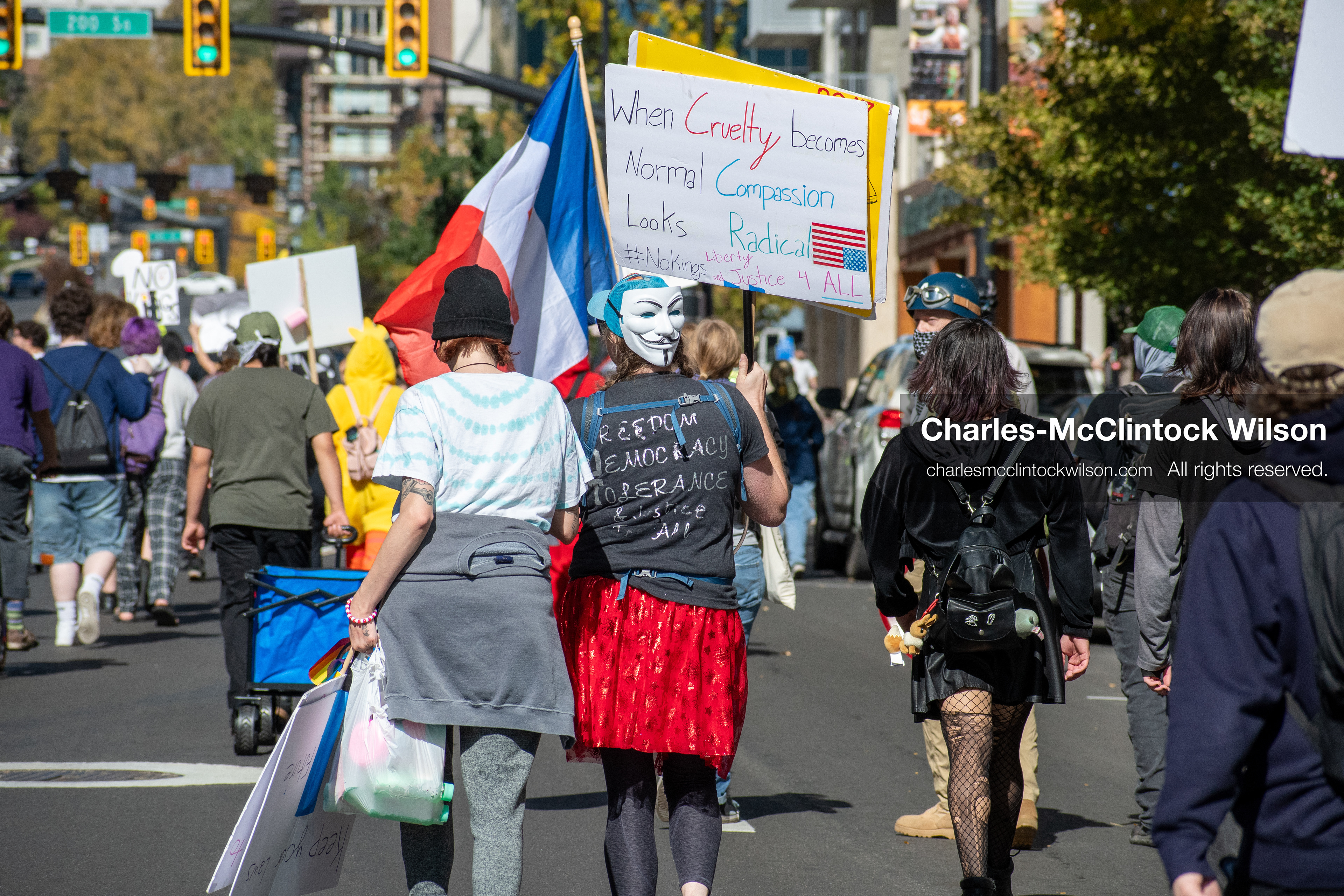 October 18, 2025, Salt Lake City, Utah, USA: Demonstrators march along South State Street during a "No Kings" protest in Salt Lake City, Utah. The protest was part of a nationwide mobilization.
