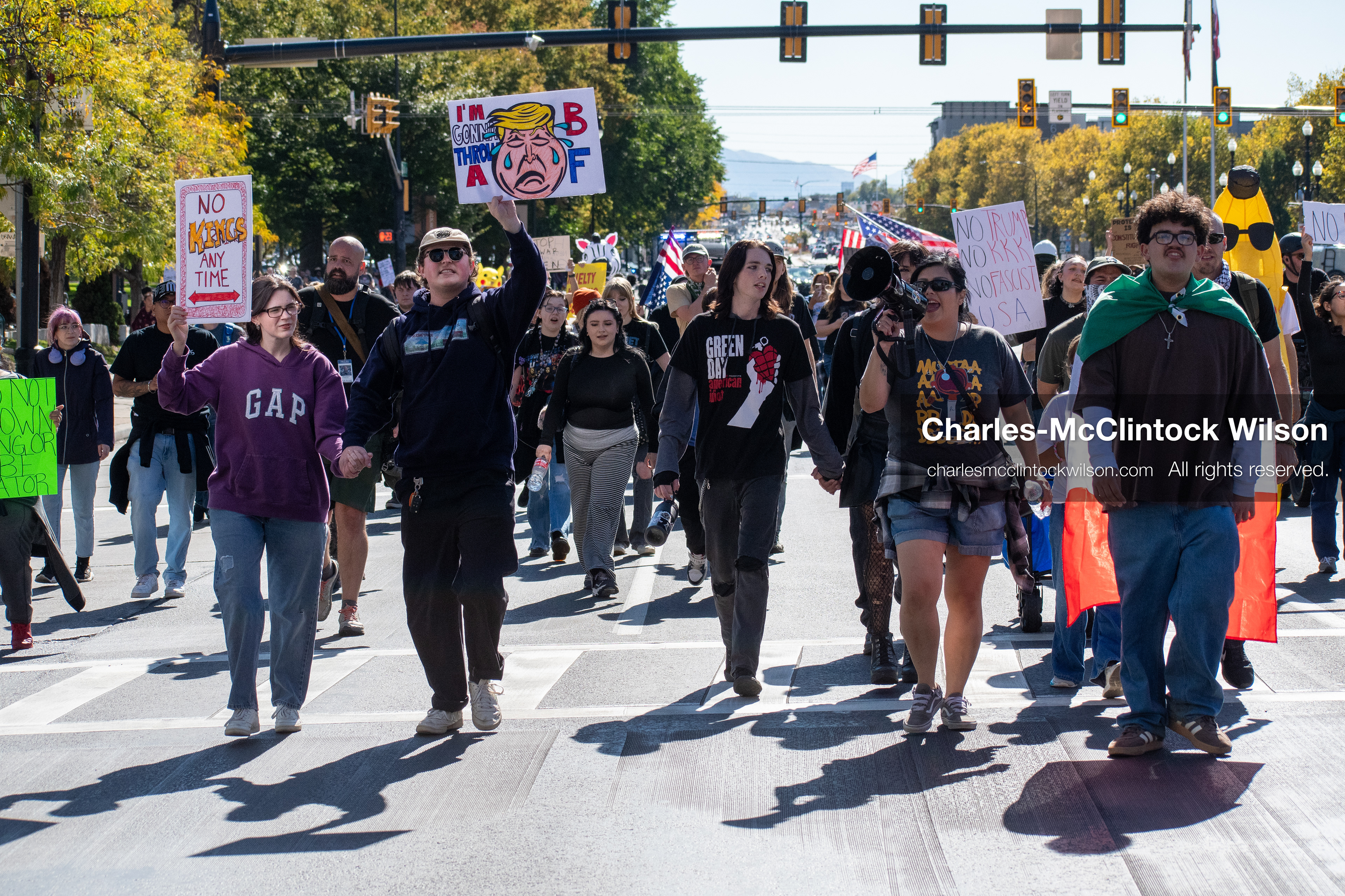 October 18, 2025, Salt Lake City, Utah, USA: Demonstrators march along South State Street during a "No Kings" protest in Salt Lake City, Utah. The protest was part of a nationwide mobilization.