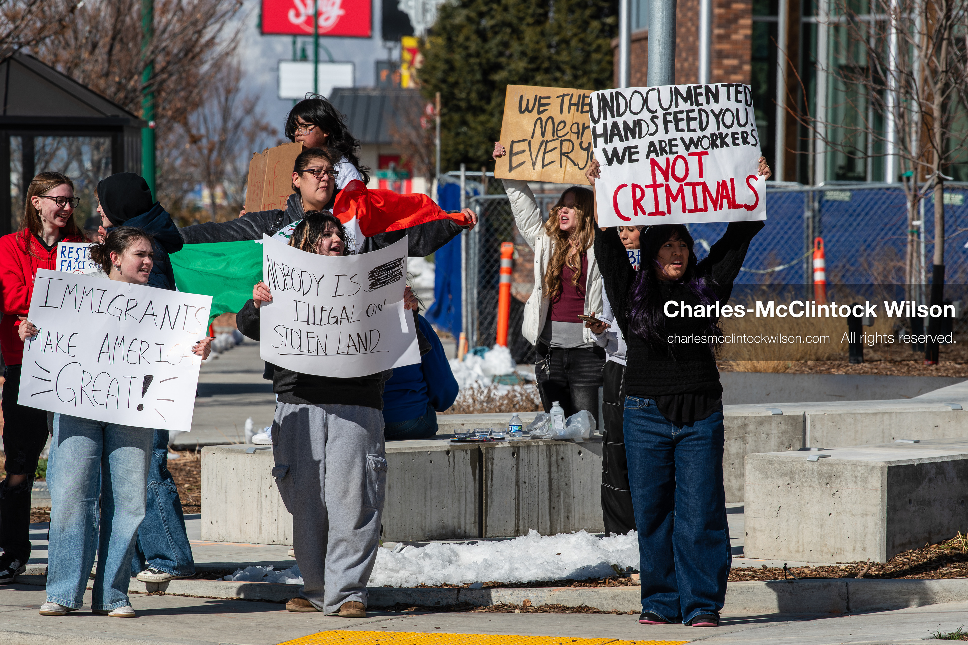 February 20, 2026, Orem, Utah, USA: High school students gather along State Street in front of Orem City Hall during a student led protest against ICE and federal immigration enforcement. Demonstrators hold signs as they stand near the roadway while traffic continues through the area. (Credit Image: © Charles McClintock Wilson/ZUMA Press Wire)