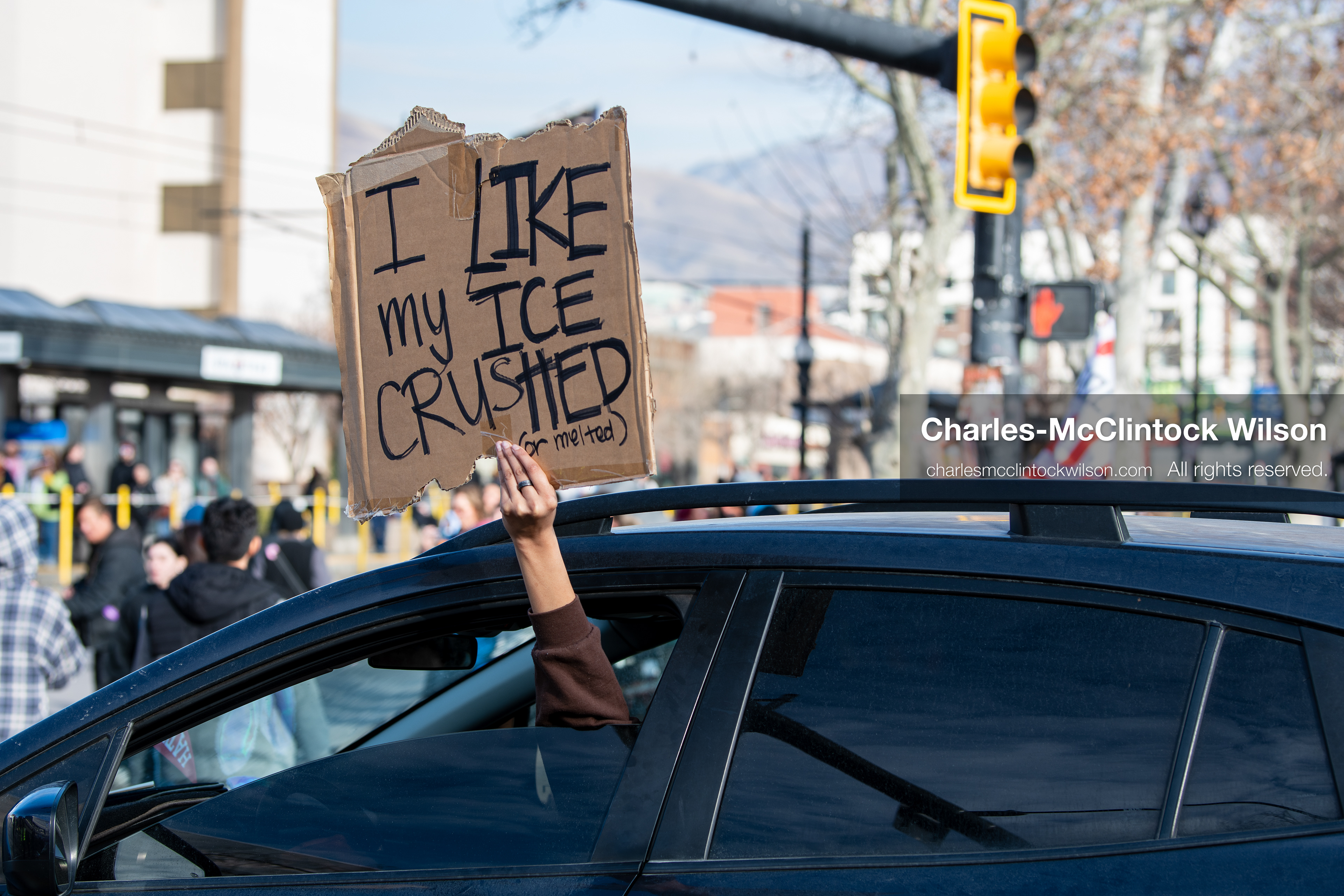 January 30, 2026, Salt Lake City, Utah, USA: A demonstrator displays a protest sign from a vehicle during an anti‑ICE protest in Salt Lake City, part of a nationwide response to immigration enforcement policies. (Credit Image: © Charles‑McClintock Wilson/ZUMA Press Wire)