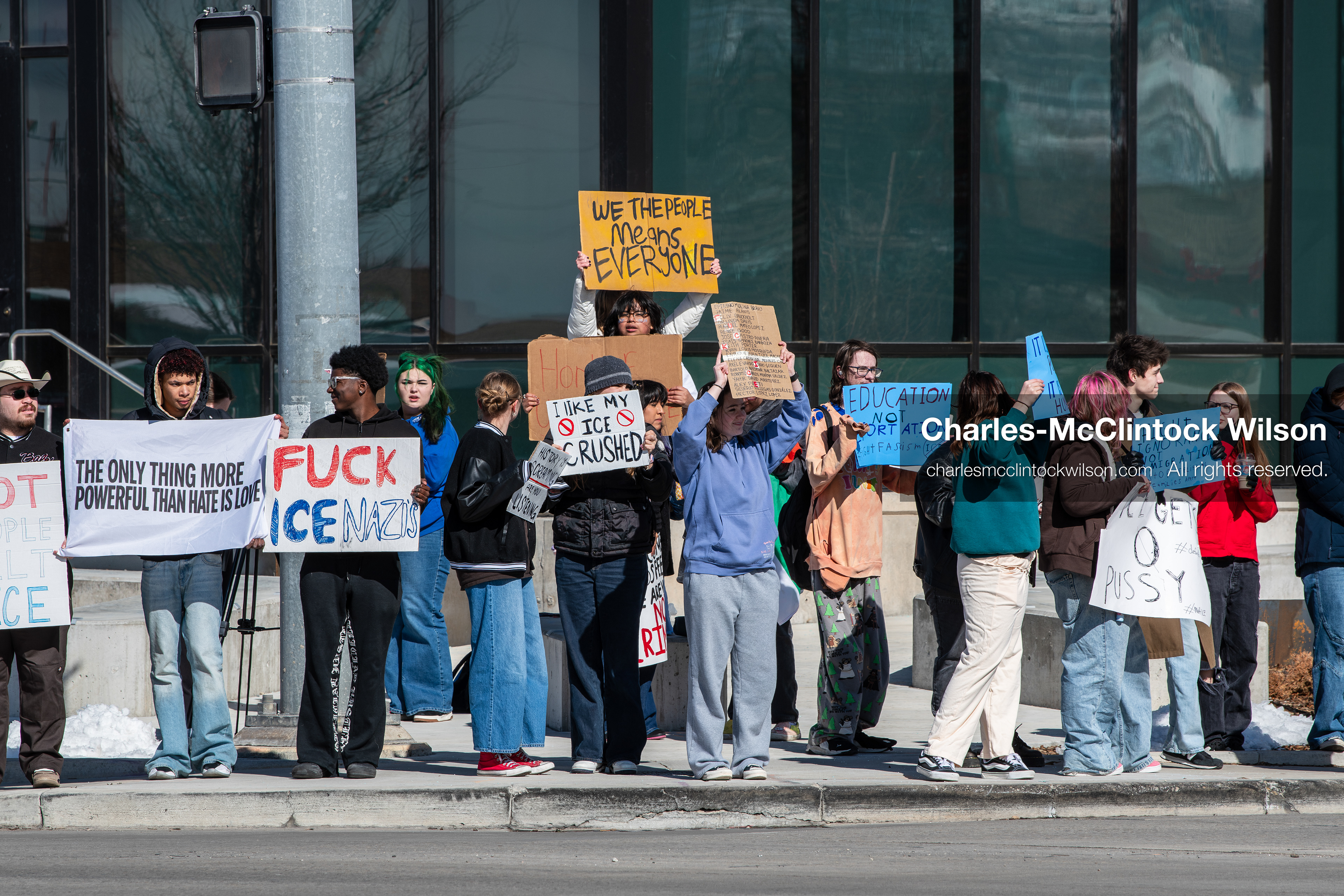 February 20, 2026, Orem, Utah, USA: High school students gather along State Street in front of Orem City Hall during a student led protest against ICE and federal immigration enforcement. Demonstrators hold signs as they stand near the roadway while traffic continues through the area. (Credit Image: © Charles McClintock Wilson/ZUMA Press Wire)