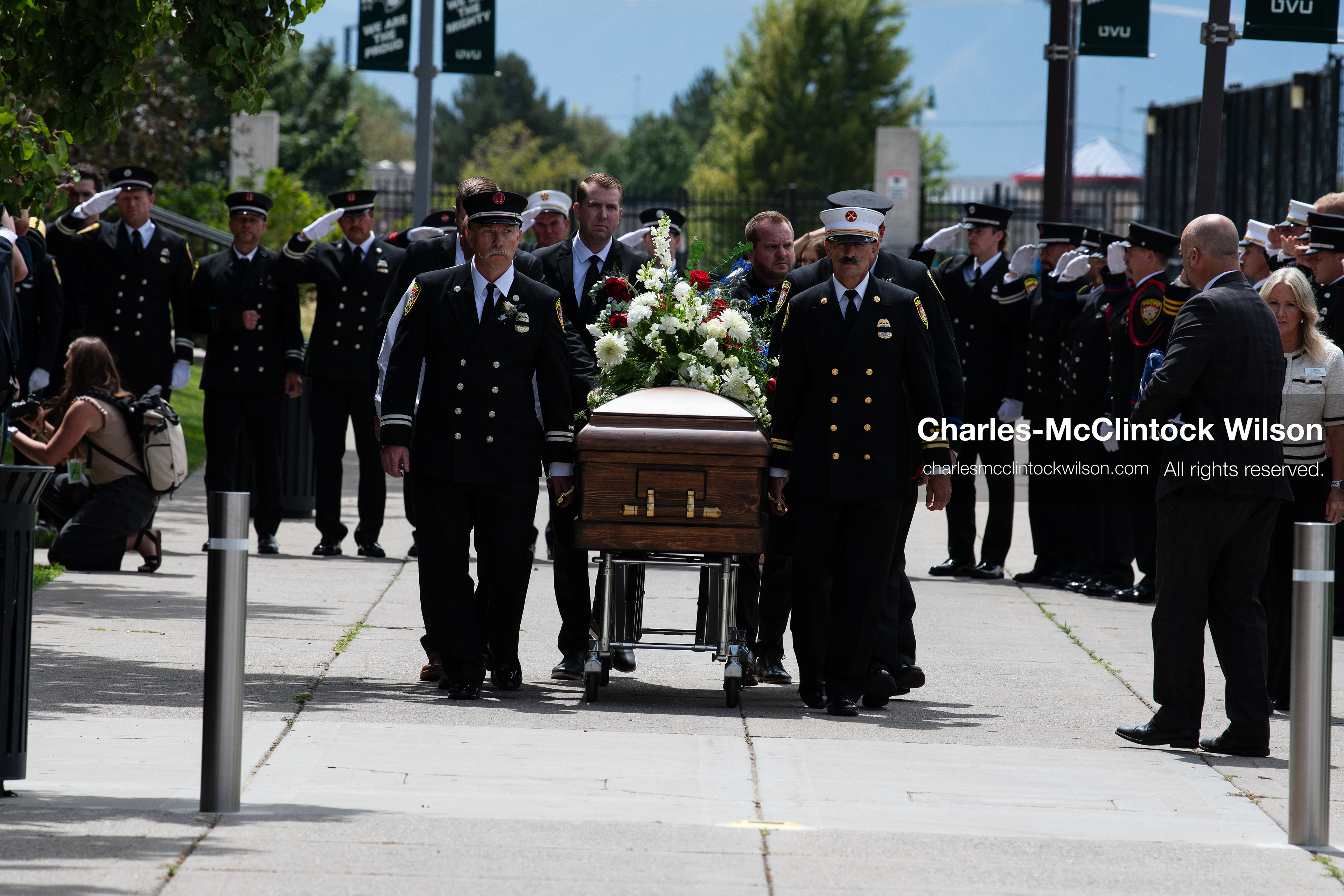 Firefighters and pallbearers escort the casket of Provo Fire Captain Spencer Long outside the UCCU Center on the campus of Utah Valley University in Orem, Utah, on Wednesday, July 29, 2026. More than 300 people came to the public memorial ceremony to honor Captain Long, his wife Katrina, and three of their sons, who died after a flash flood hit their campsite near the Sunglow Campground in Wayne County. (Photo by Charles-McClintock Wilson/Sipa USA)