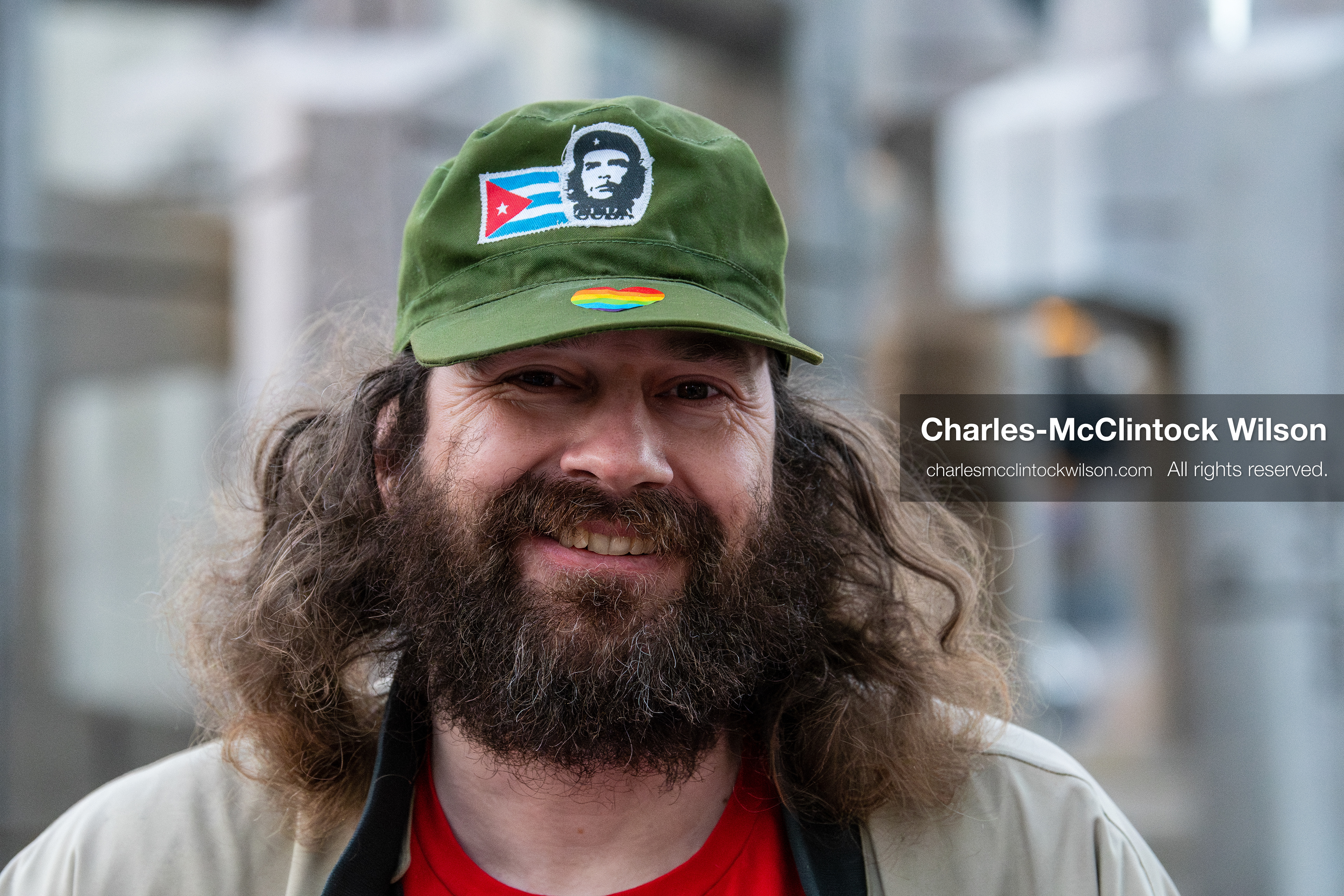 January 5, 2026, Salt Lake City, Utah, USA: A smiling demonstrator attends a protest outside the Wallace Federal Building in Salt Lake City, Utah. The rally, organized by Salt Lake Indivisible, called for congressional limits on presidential war powers following recent US military actions in Venezuela involving the government of Nicolas Maduro. Attendees signed petitions addressed to Utah US senators Mike Lee and John Curtis. (Credit Image: (c) Charles‑McClintock Wilson/ZUMA Press Wire)